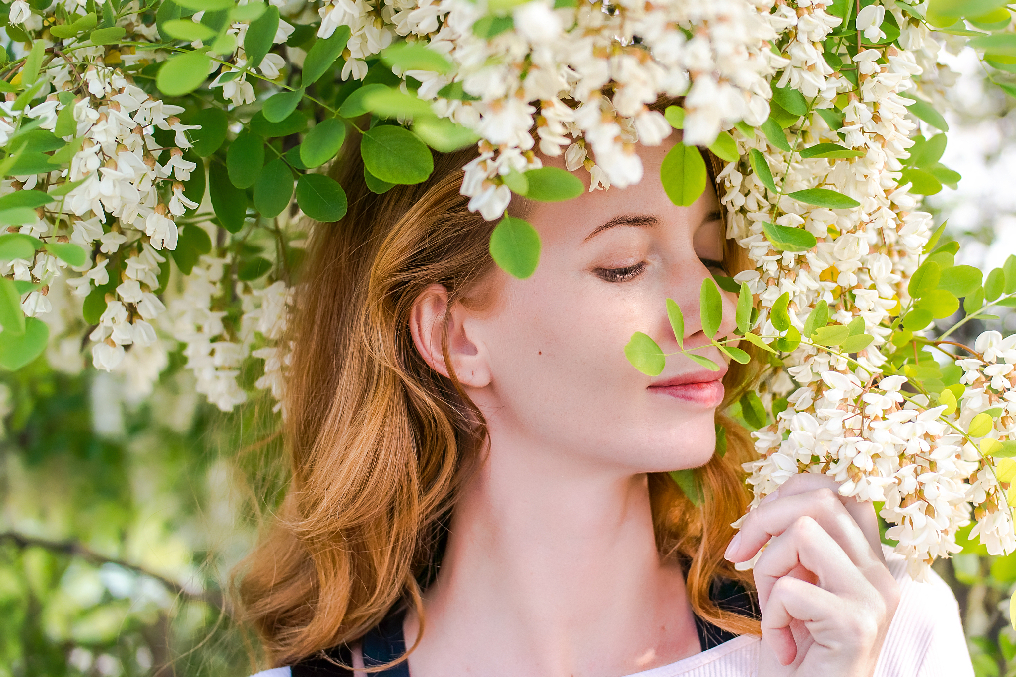 redhead model among flowers acacia