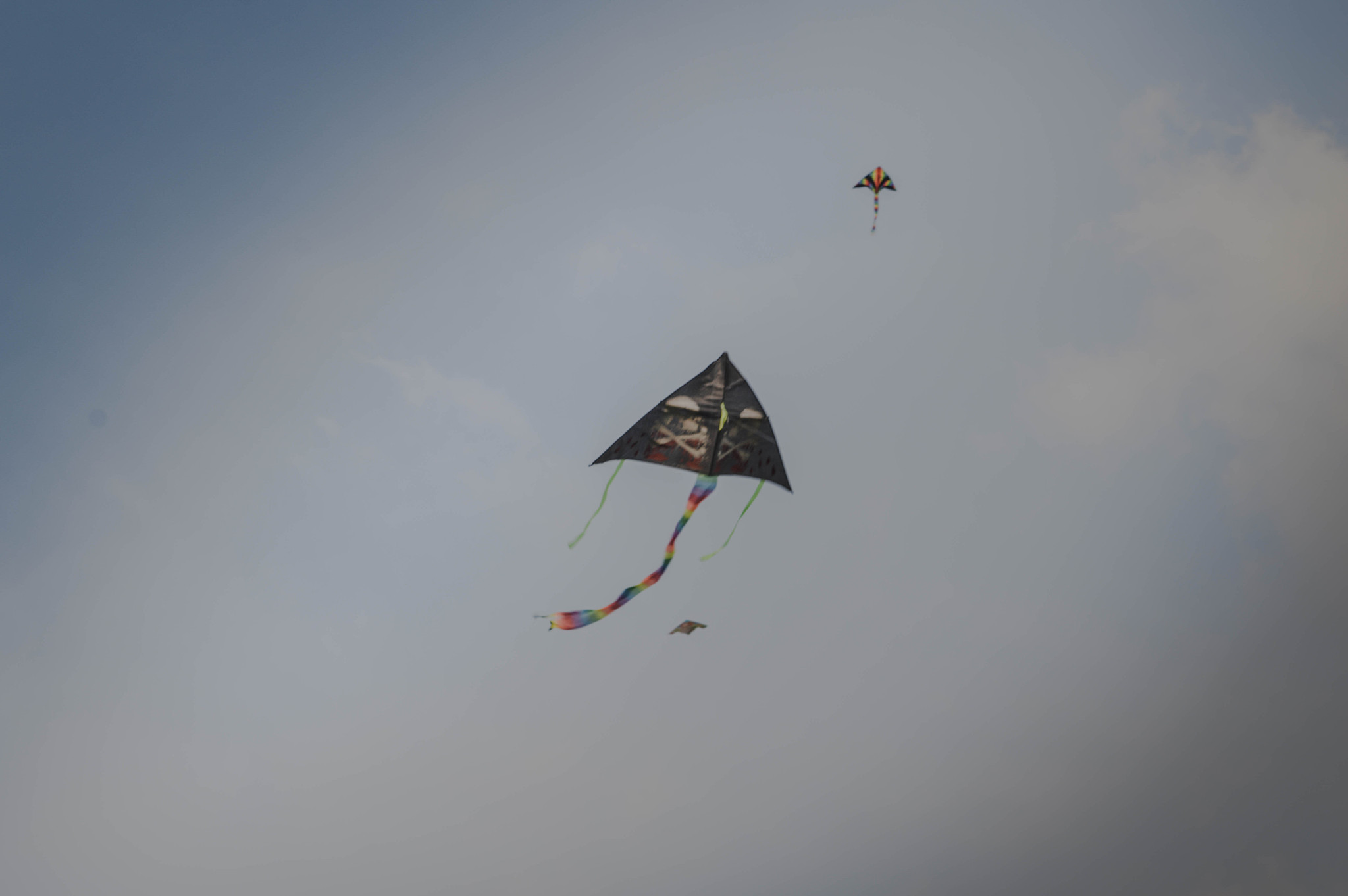 low angle view of kites flying against sky
