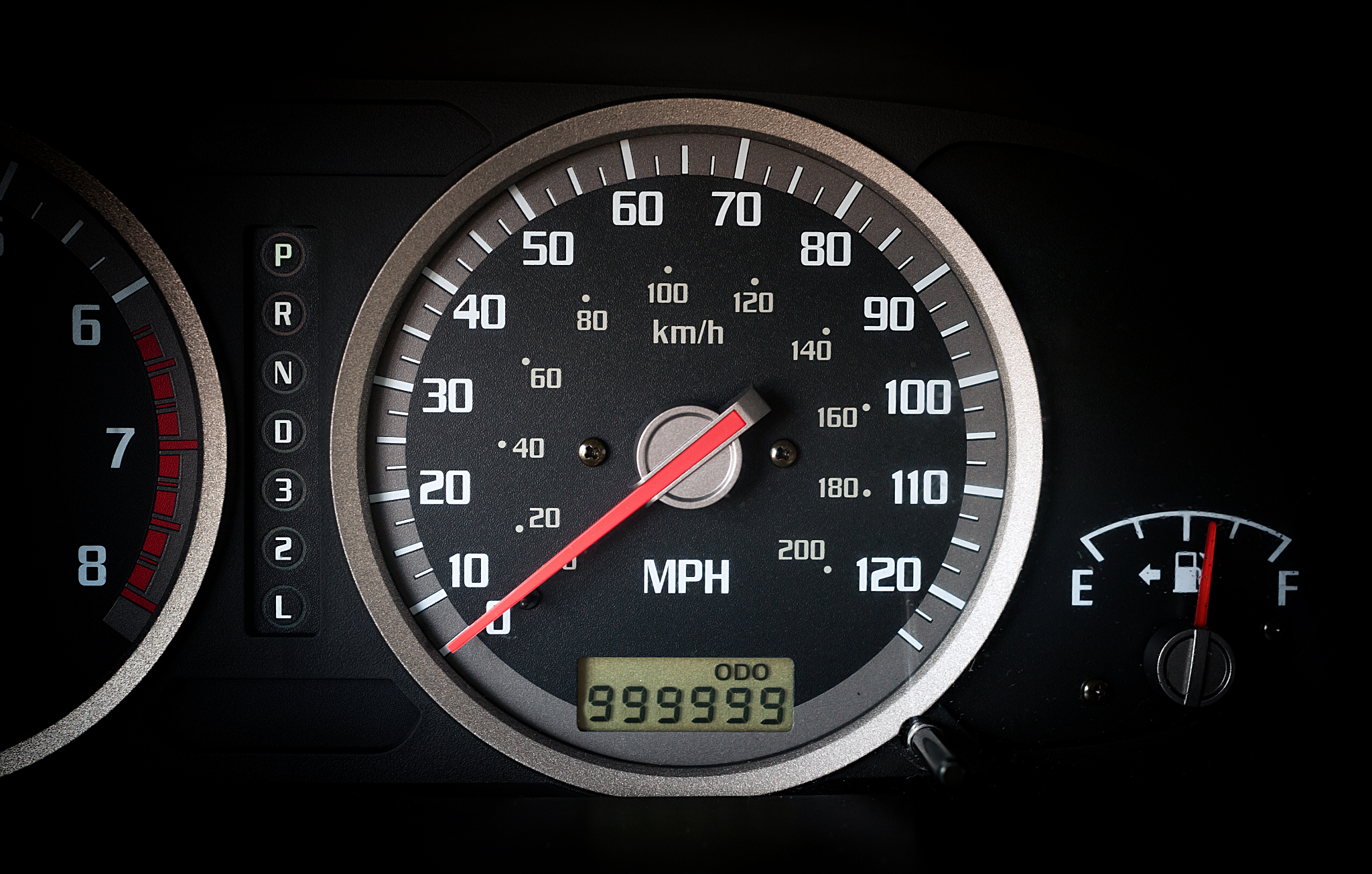car dashboard odometr with 999999 miles on odometr