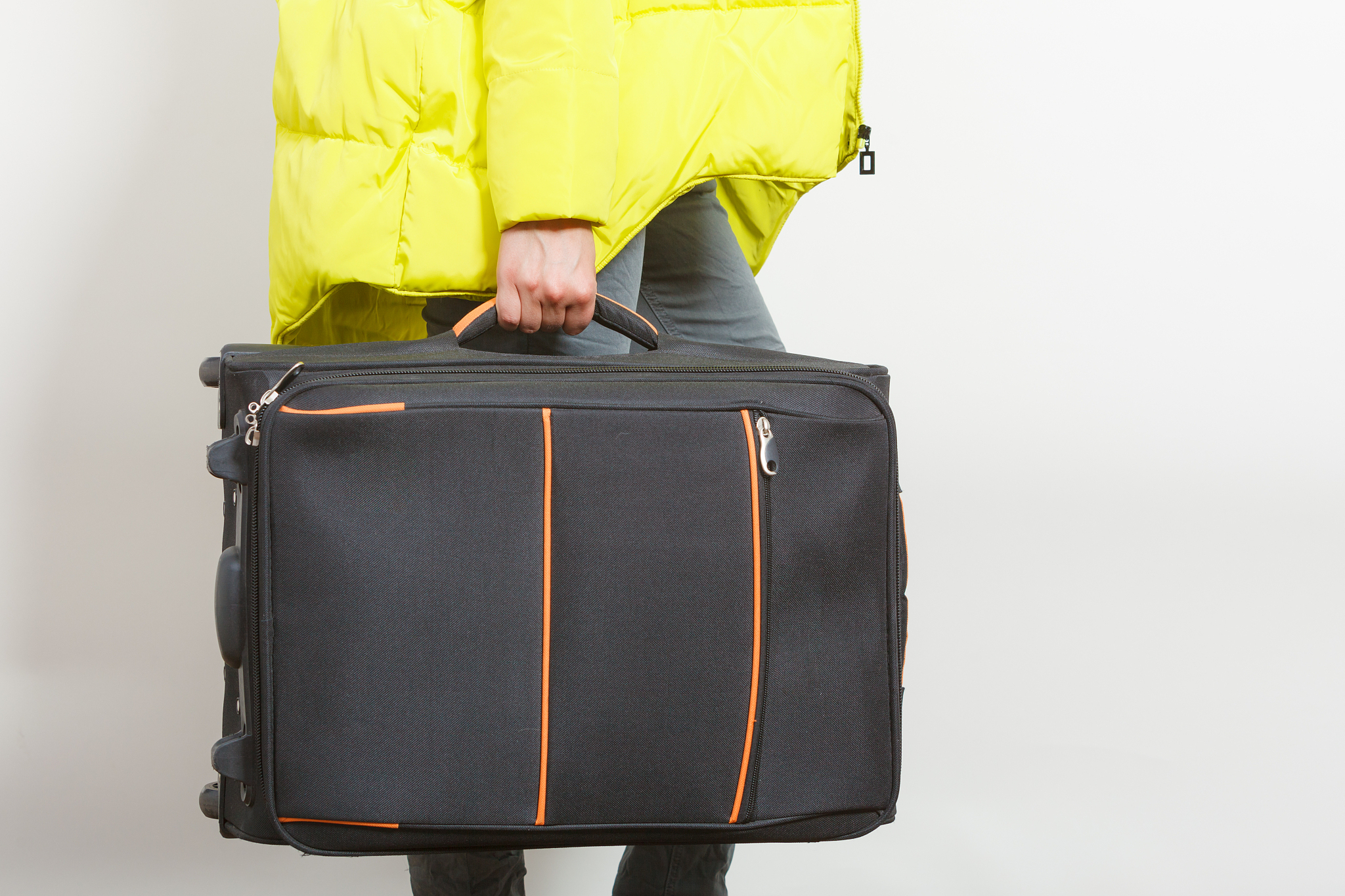 woman in warm jacket with suitcase.