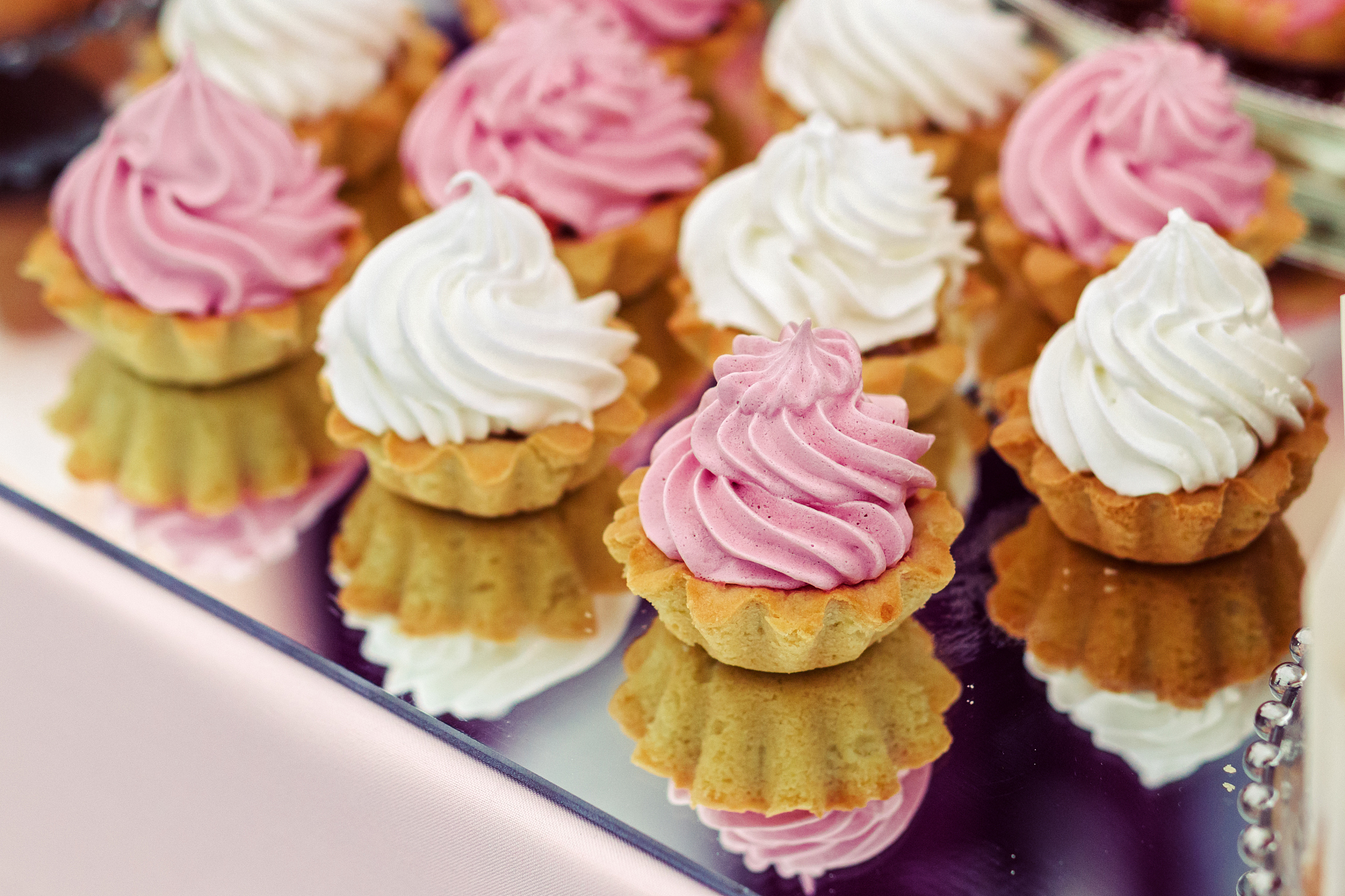 cakes on a mirrored tray