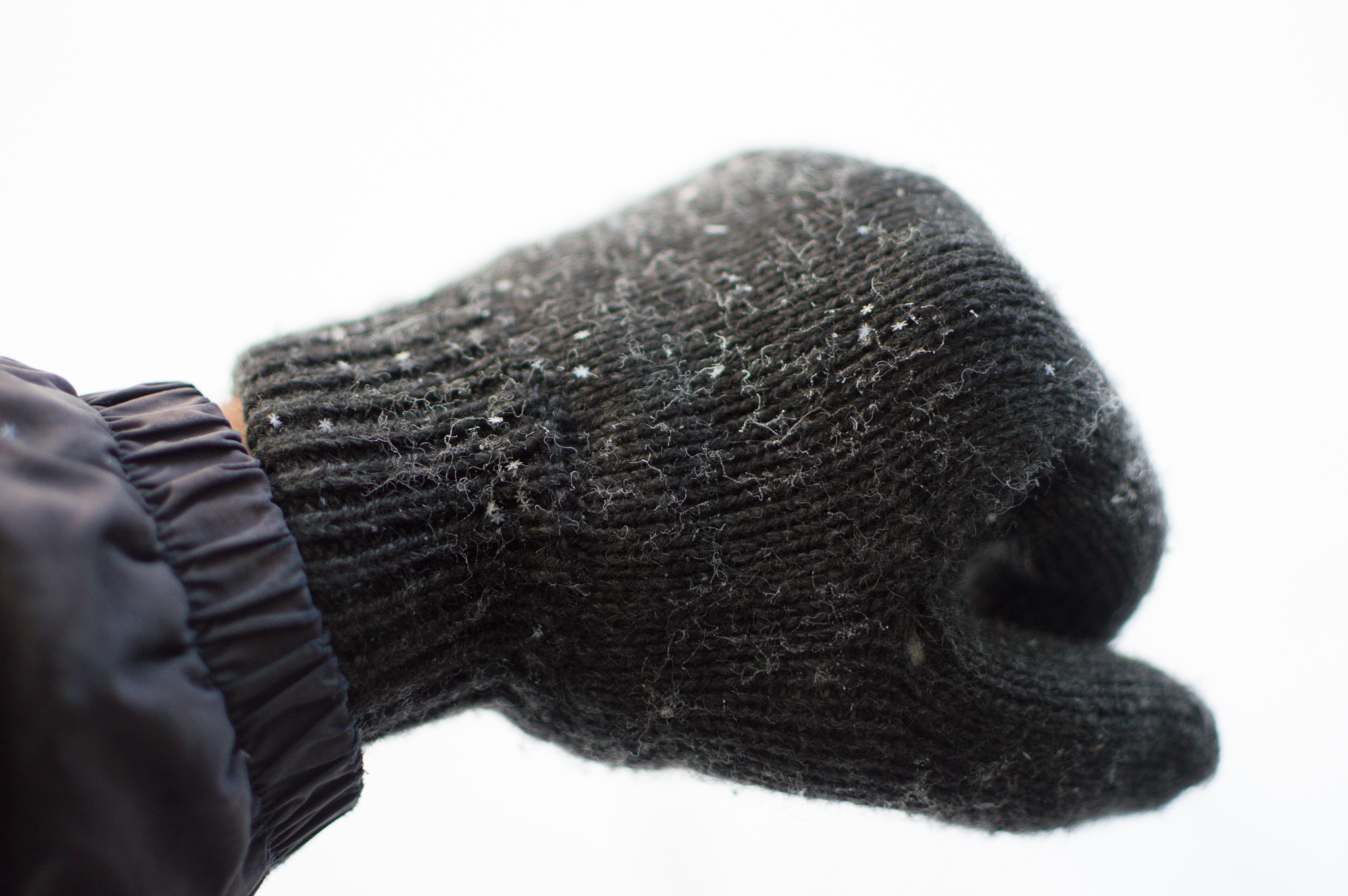 hand with glove and snowflakes in winter, astana, kazakhstan