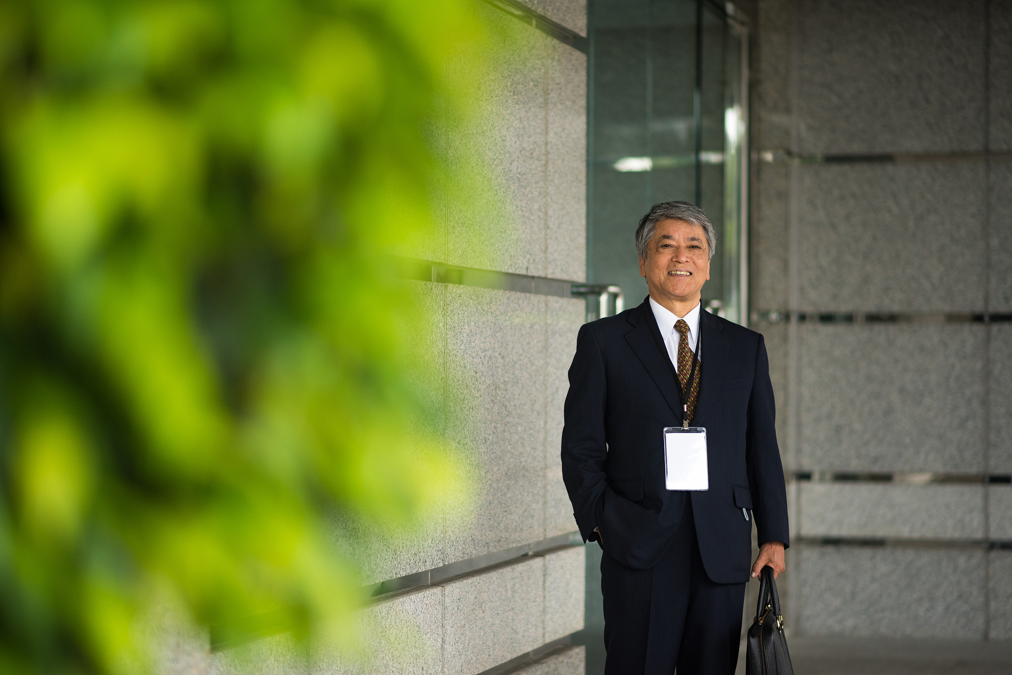 senior asian businessman on the move