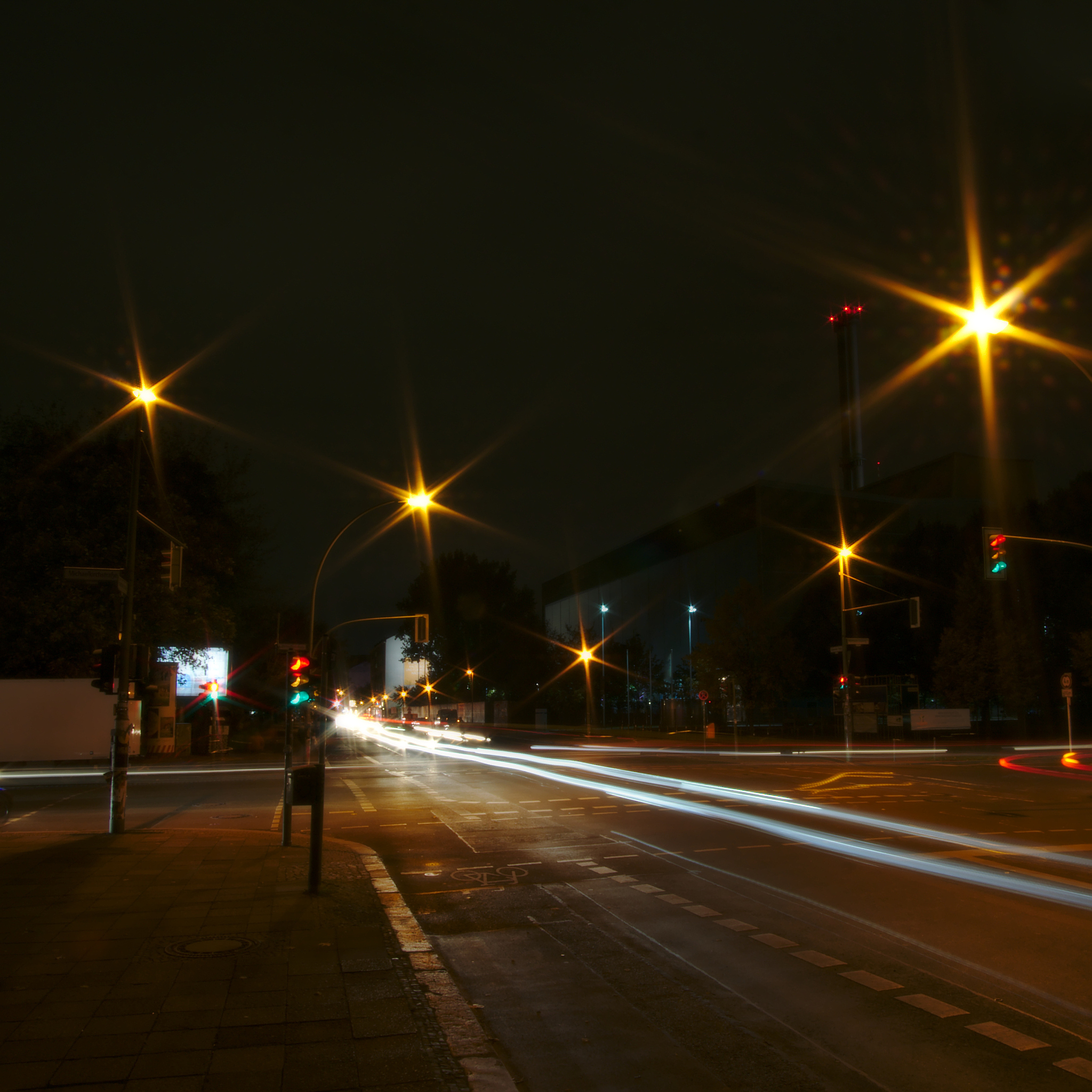 light trails on road in city at night