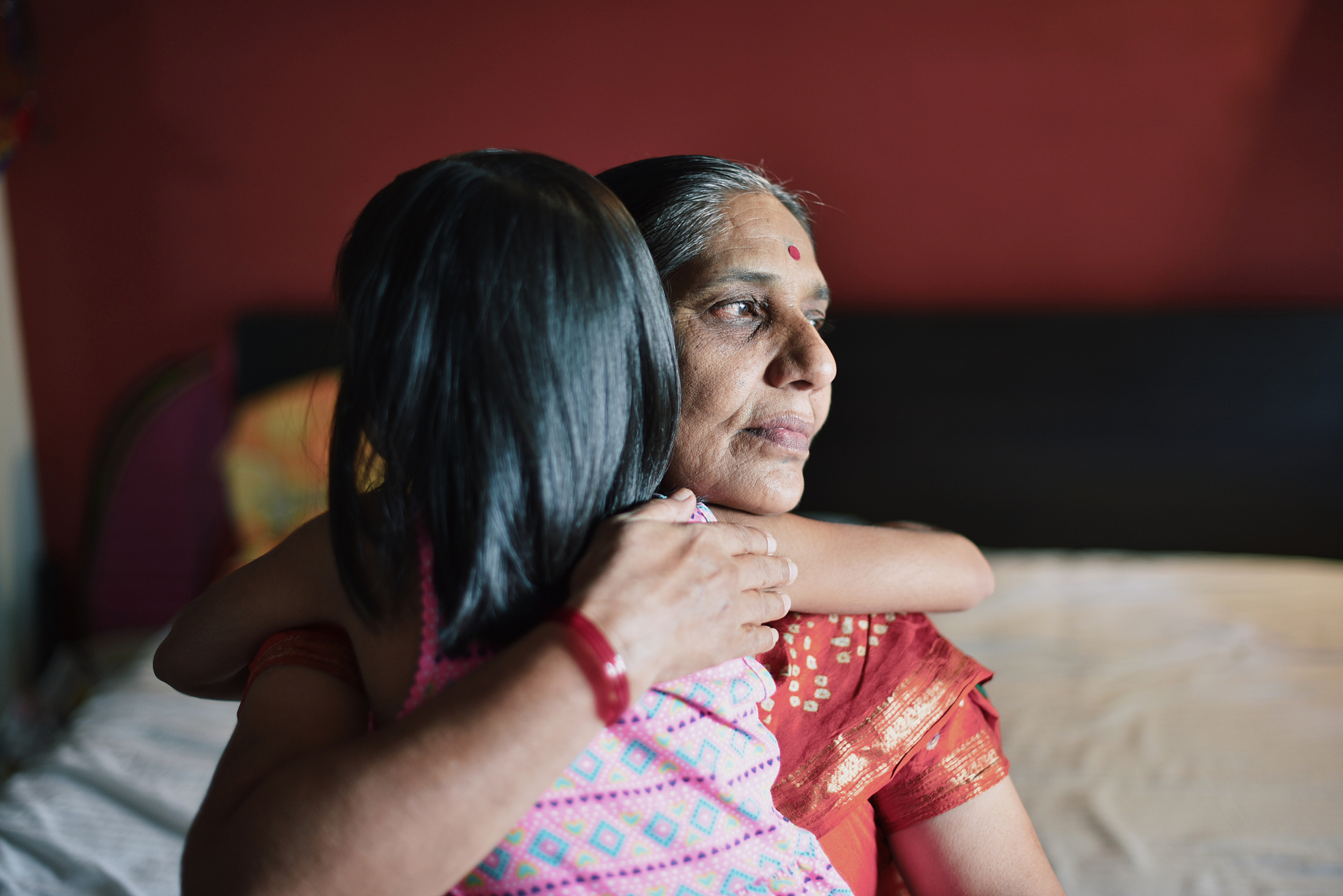 granddaughter hugs grandmother