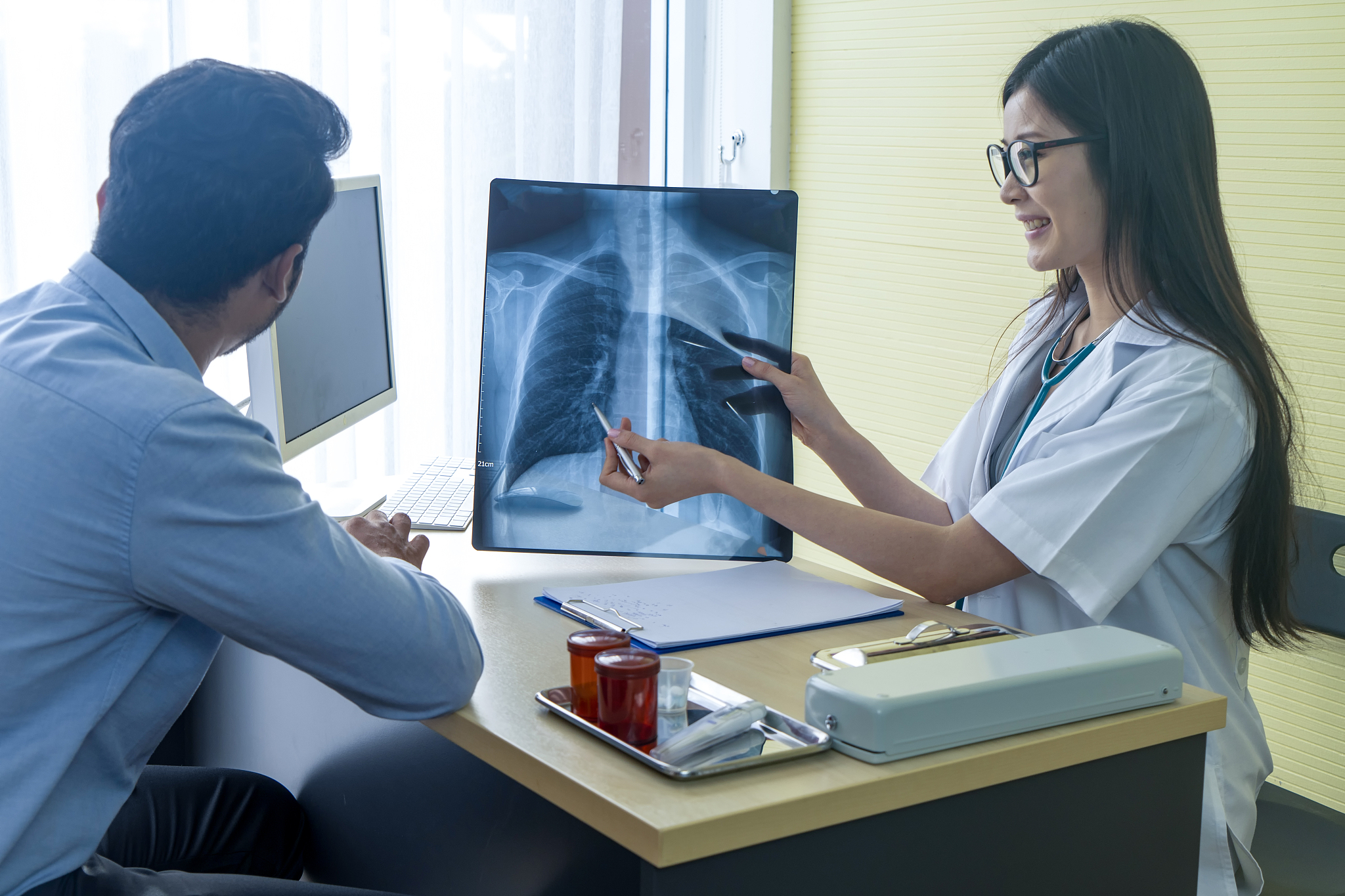 doctor analyze coronavirus disease 2019 or covid-19 displayed on