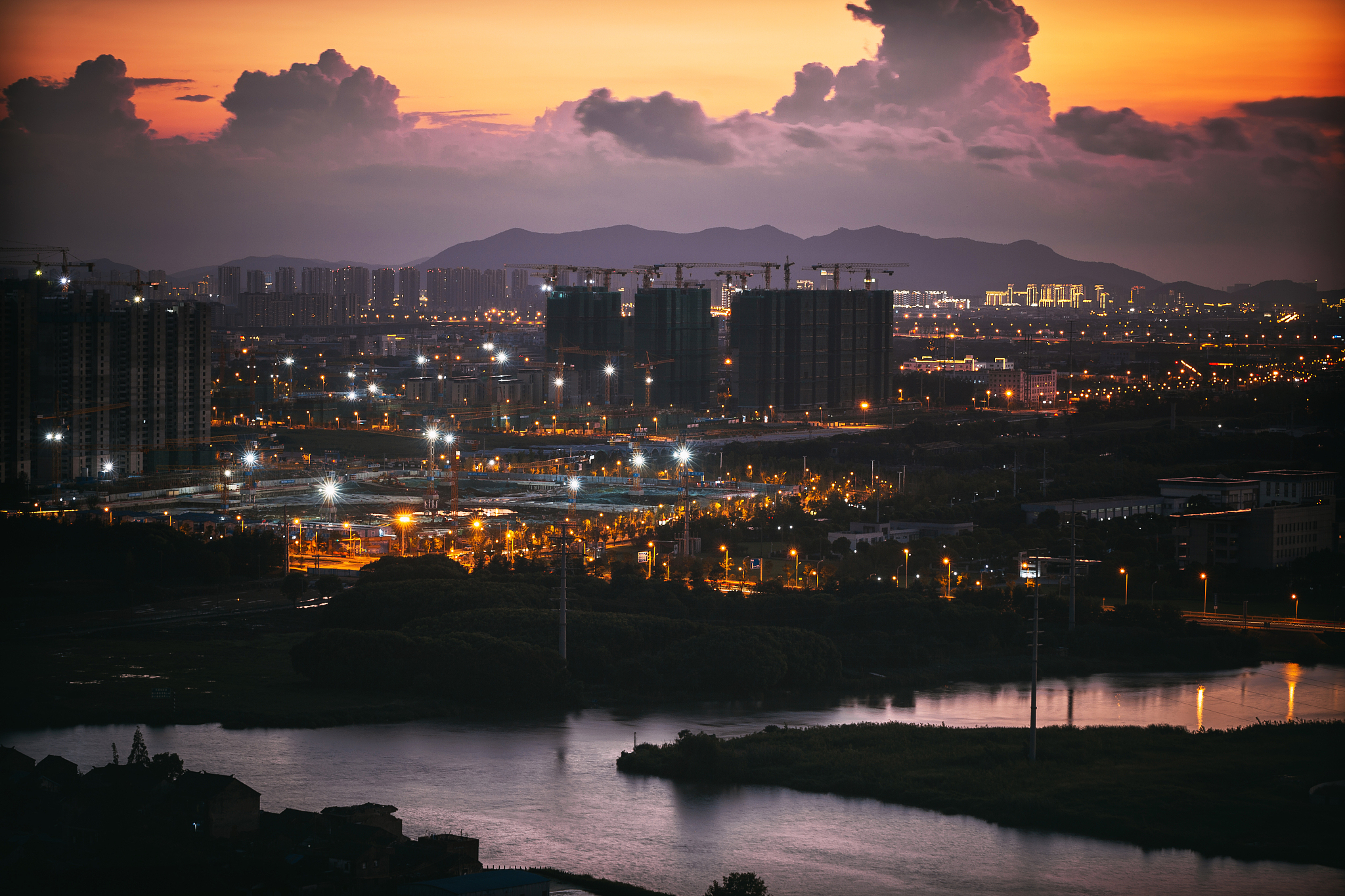 freeway in night with cars light in modern city.