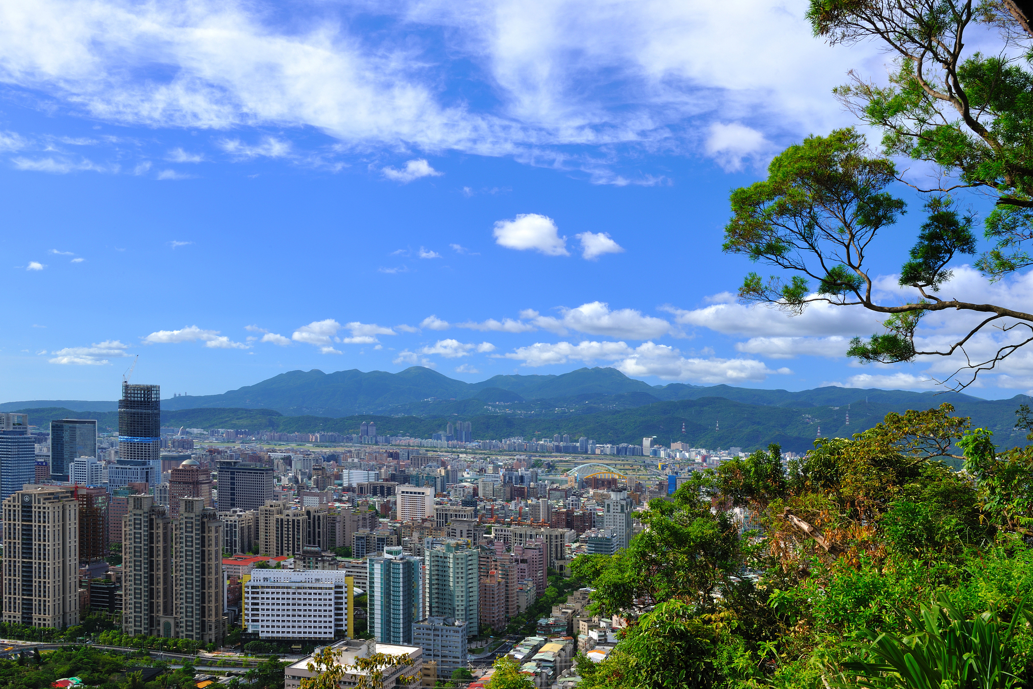 view of cityscape against cloudy sky
