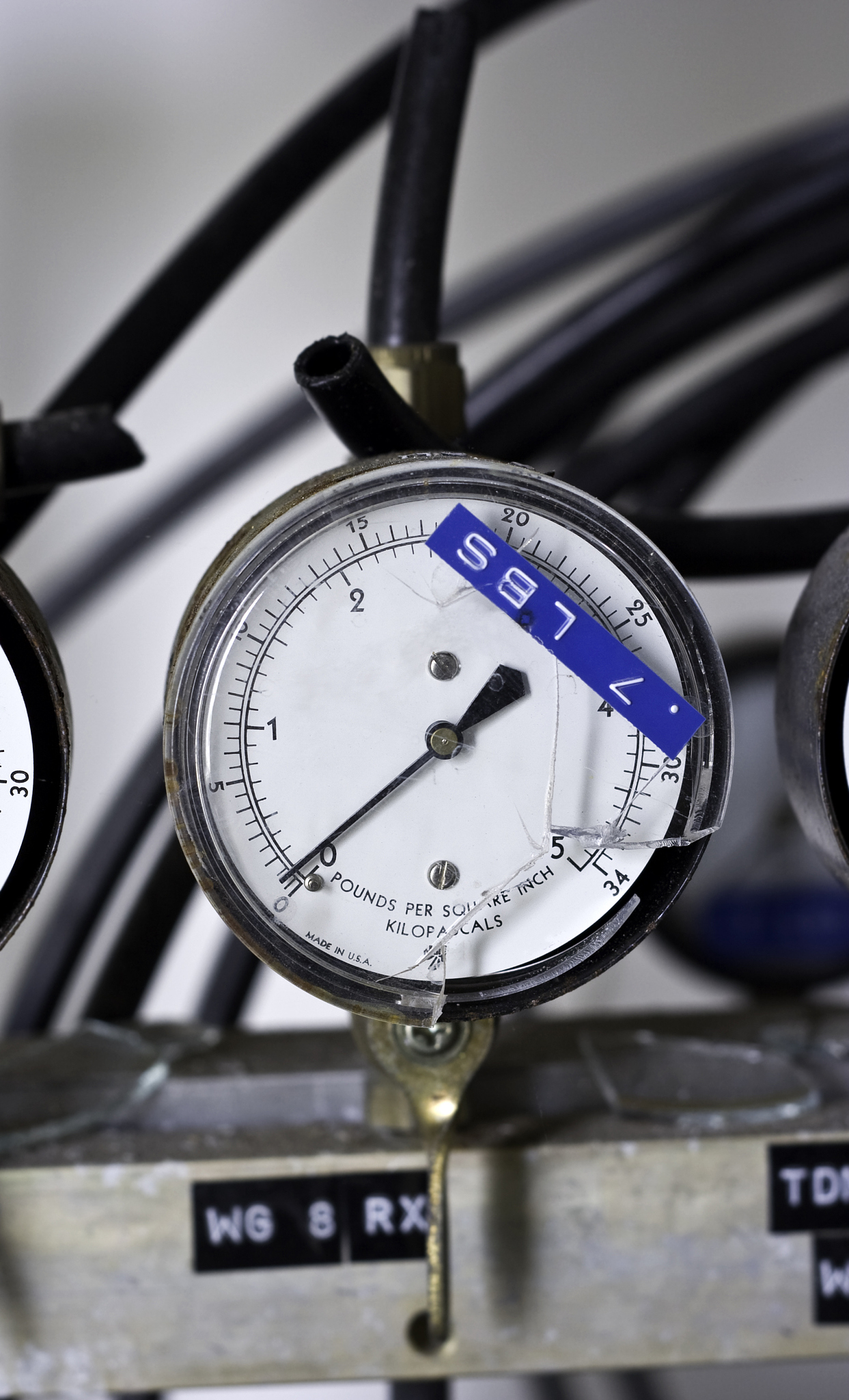 broken pressure gauge at an abandoned factory