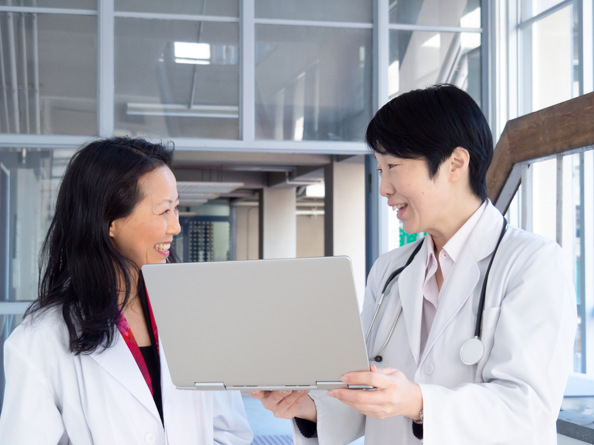 asian doctors in hospital corridor.