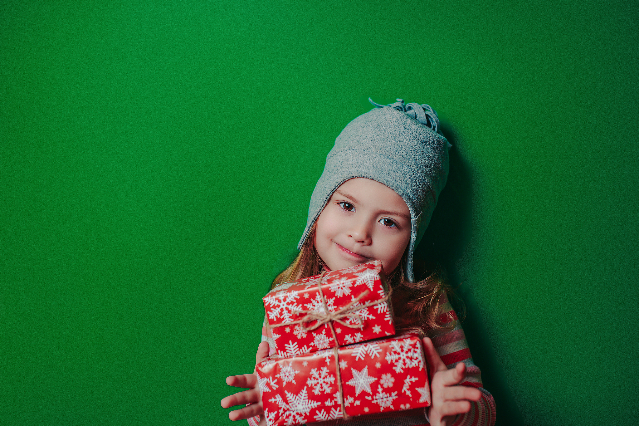 christmas card with baby girl on the green background with copy 