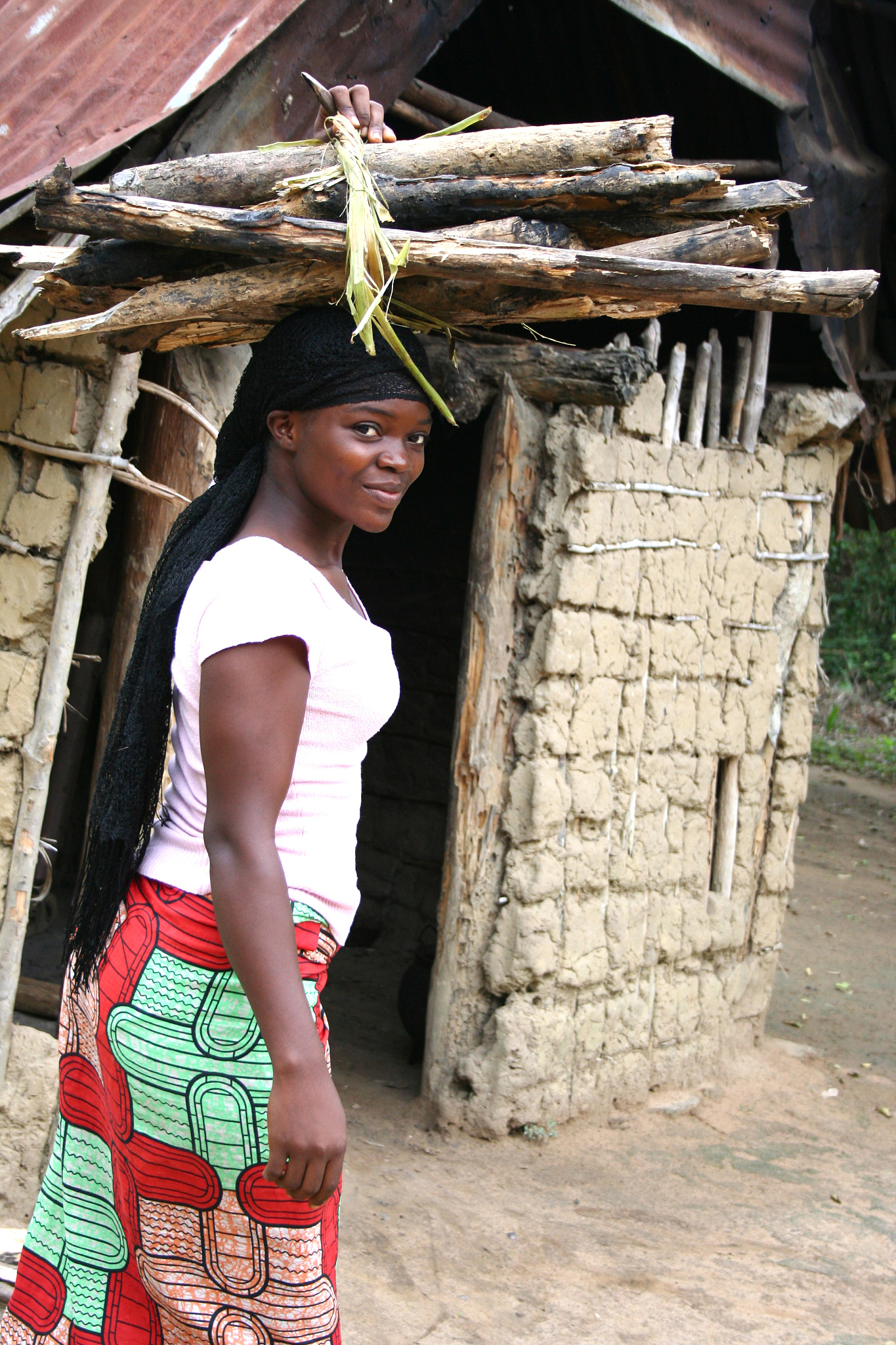 african woman with wood on her head