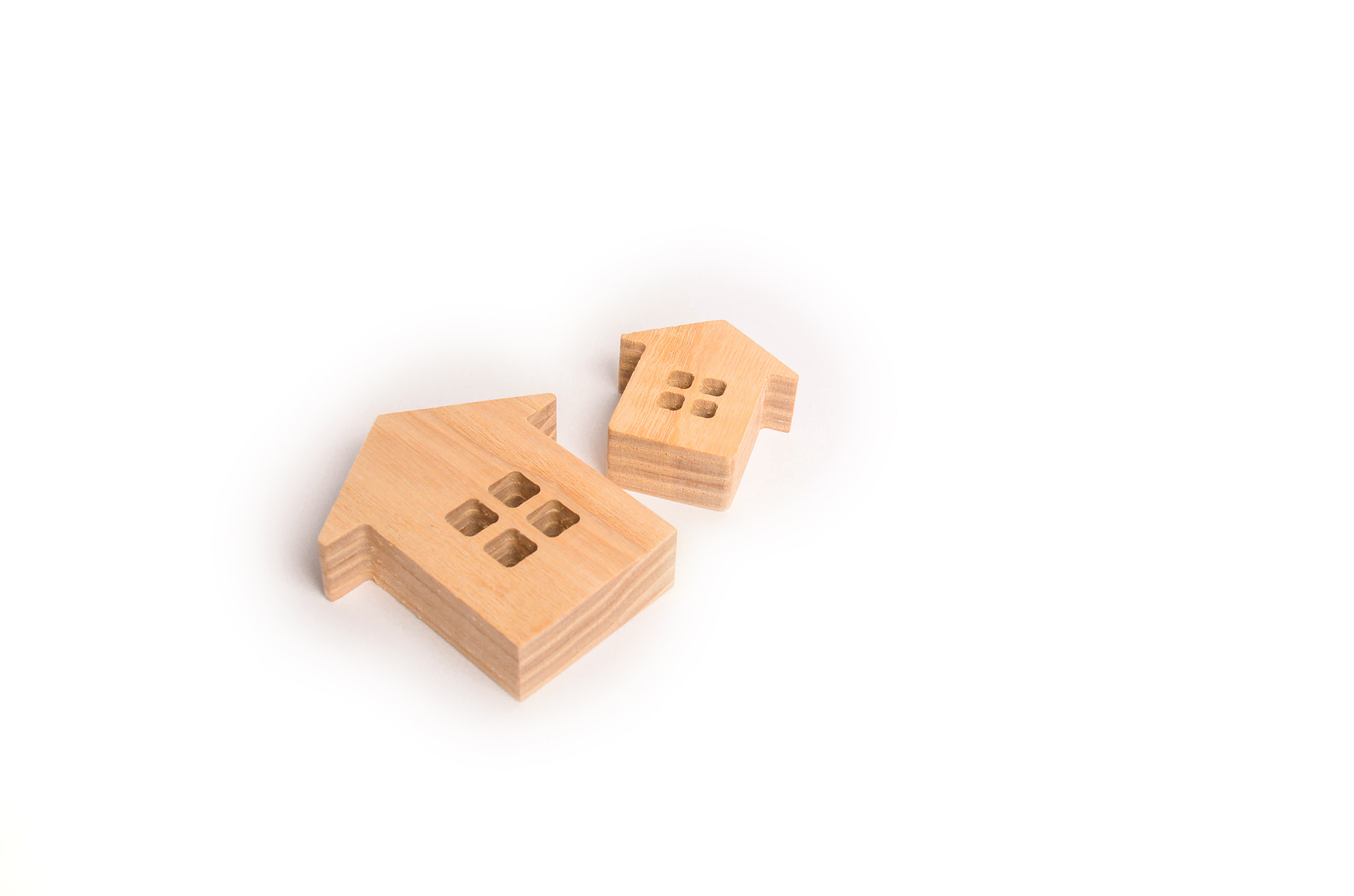 two wooden houses on a white background. concept of real estate,