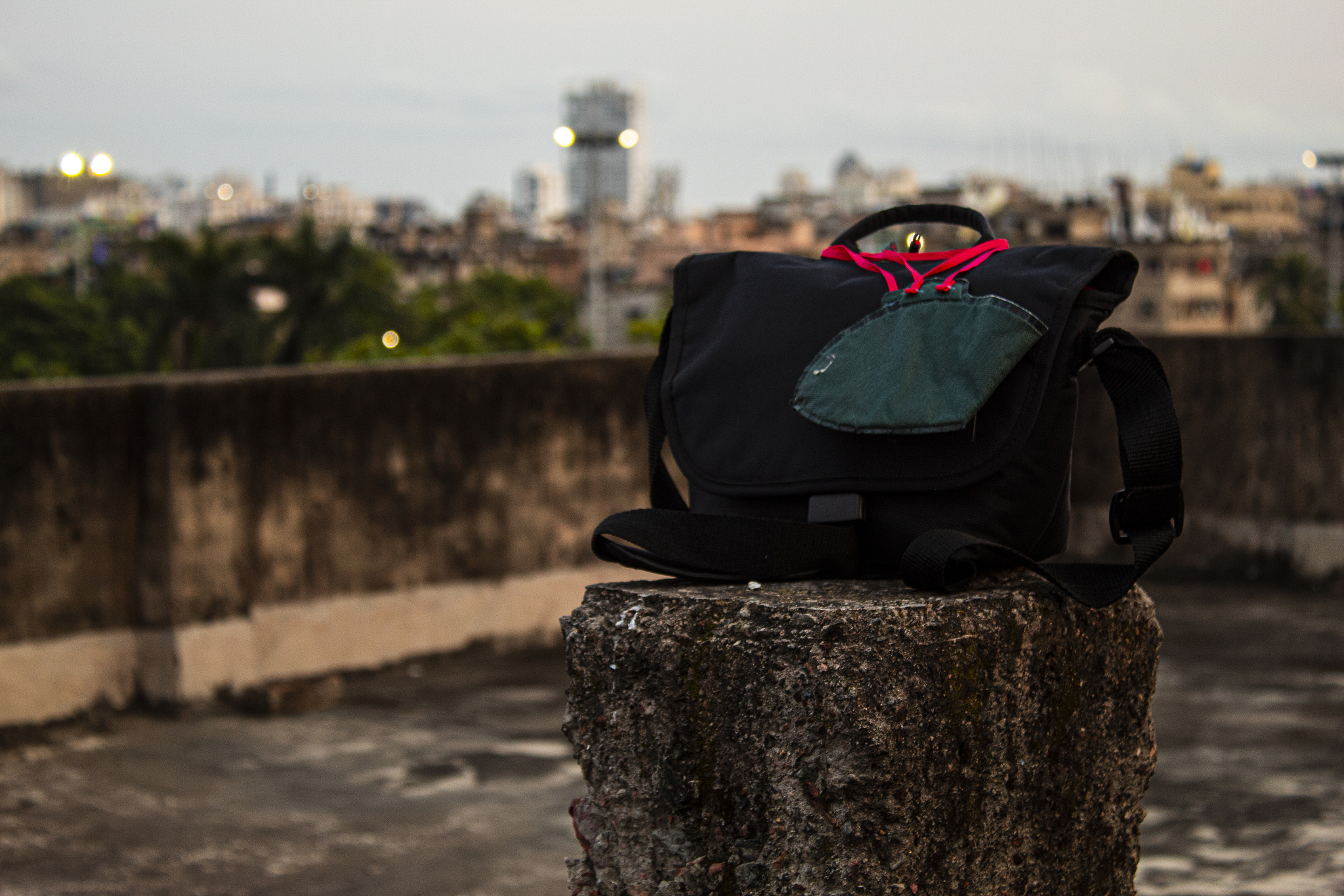 a face mask on a camera bag