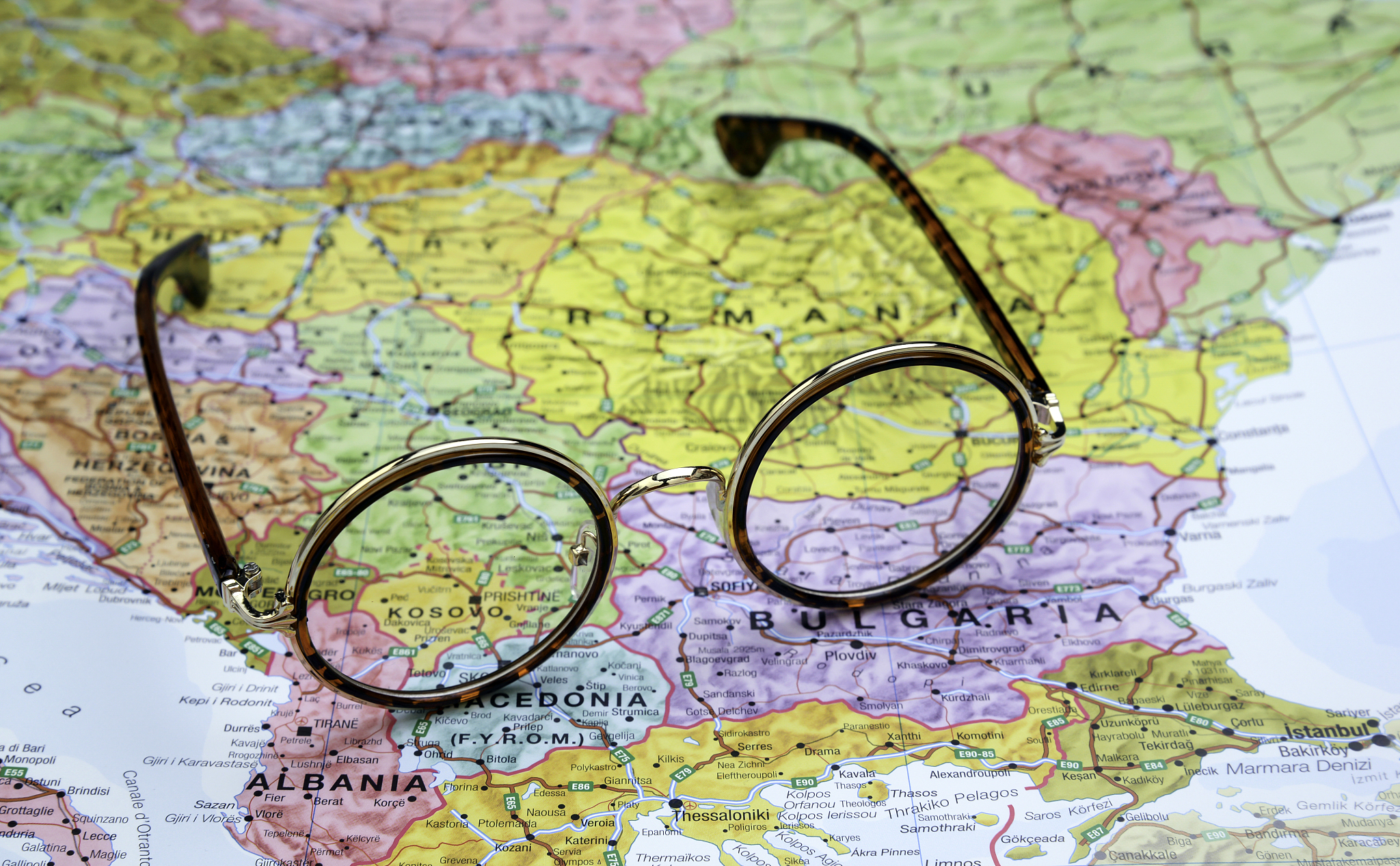 glasses on a map of europe - kosovo