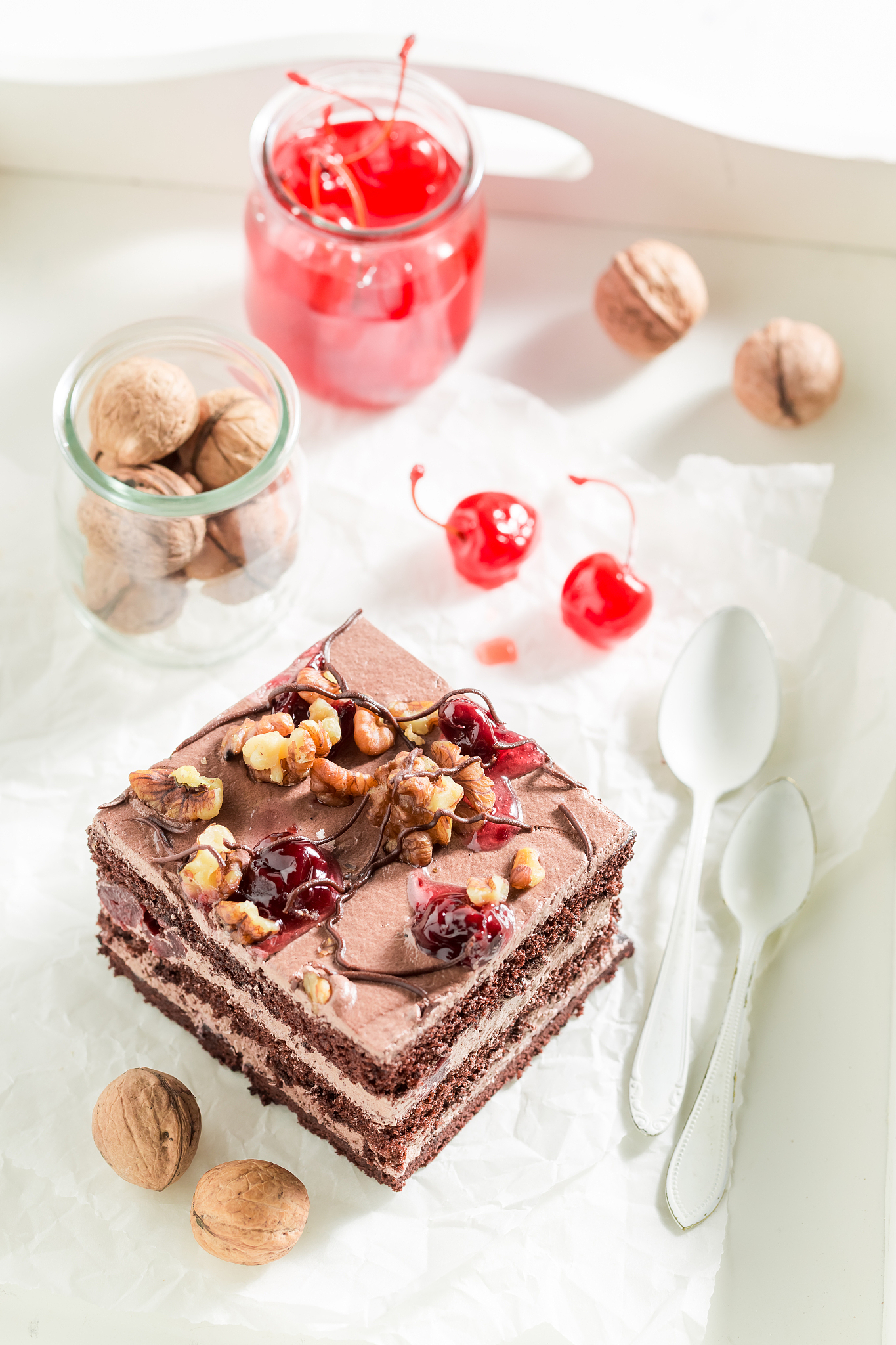 homemade chocolate cake with walnuts and cherry