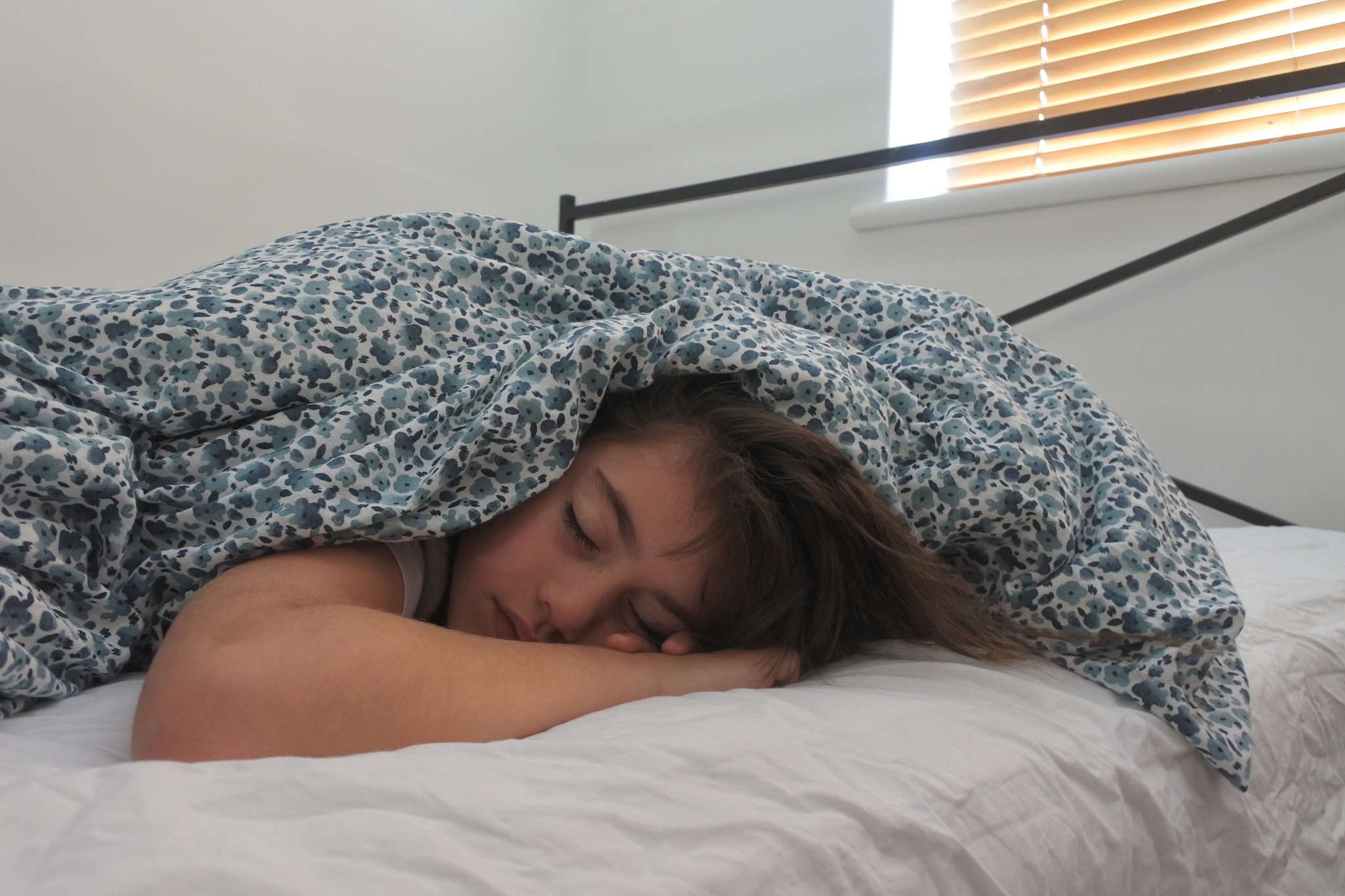 tired girl sleeping in bed sleeping in