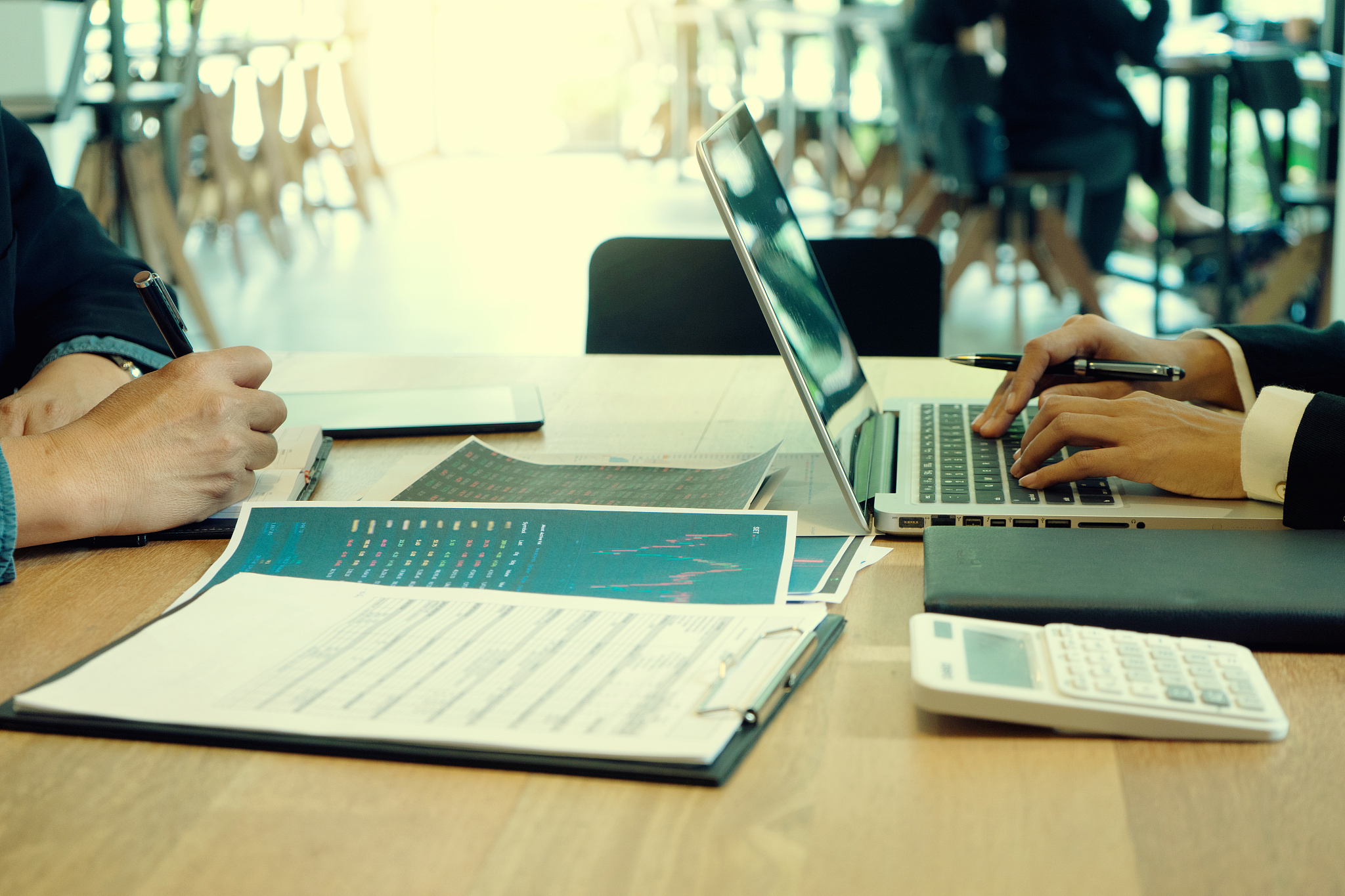 businessman and businesswoman working to analyses market stock