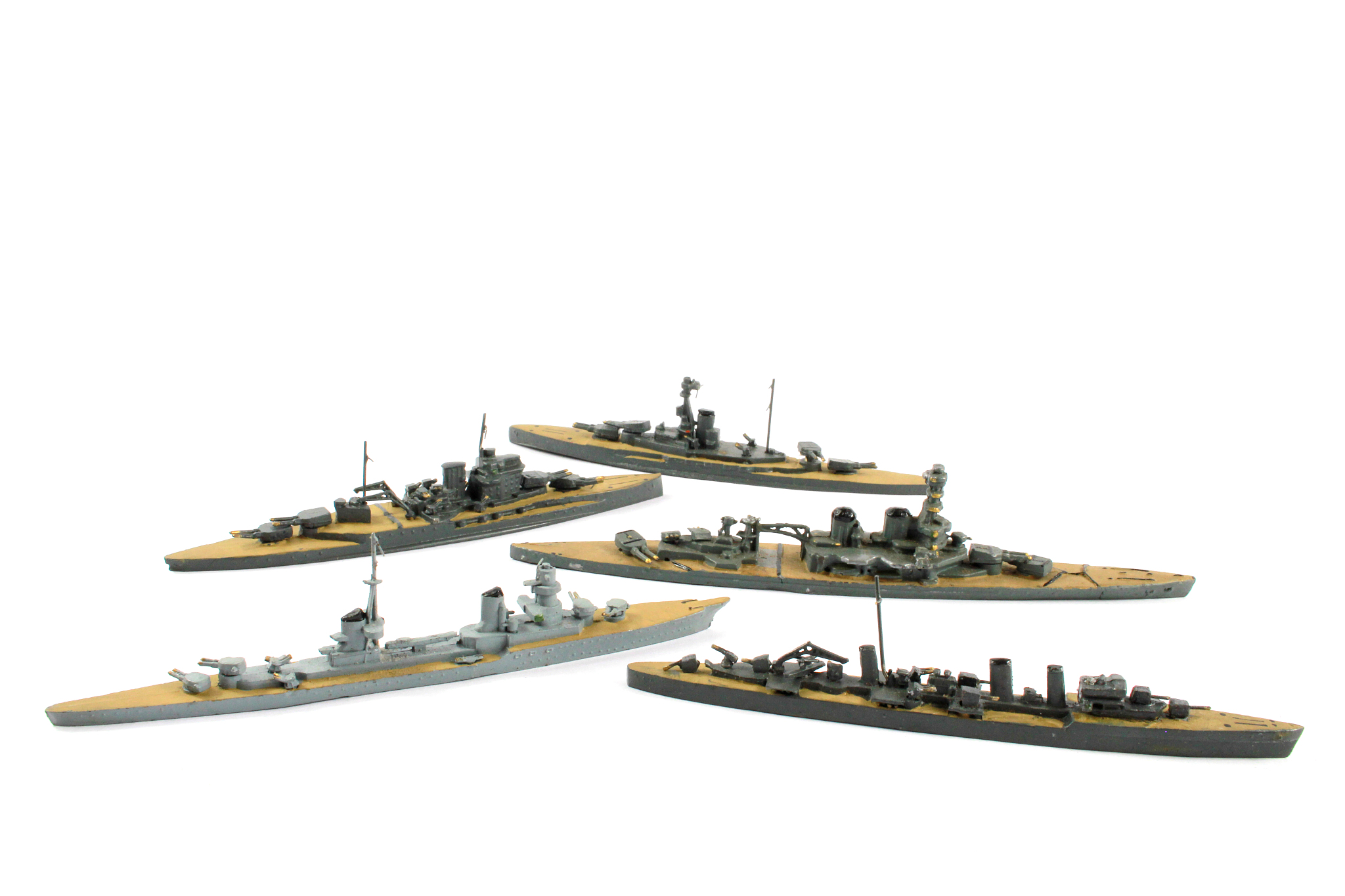 vintage toy lead battleships on white background