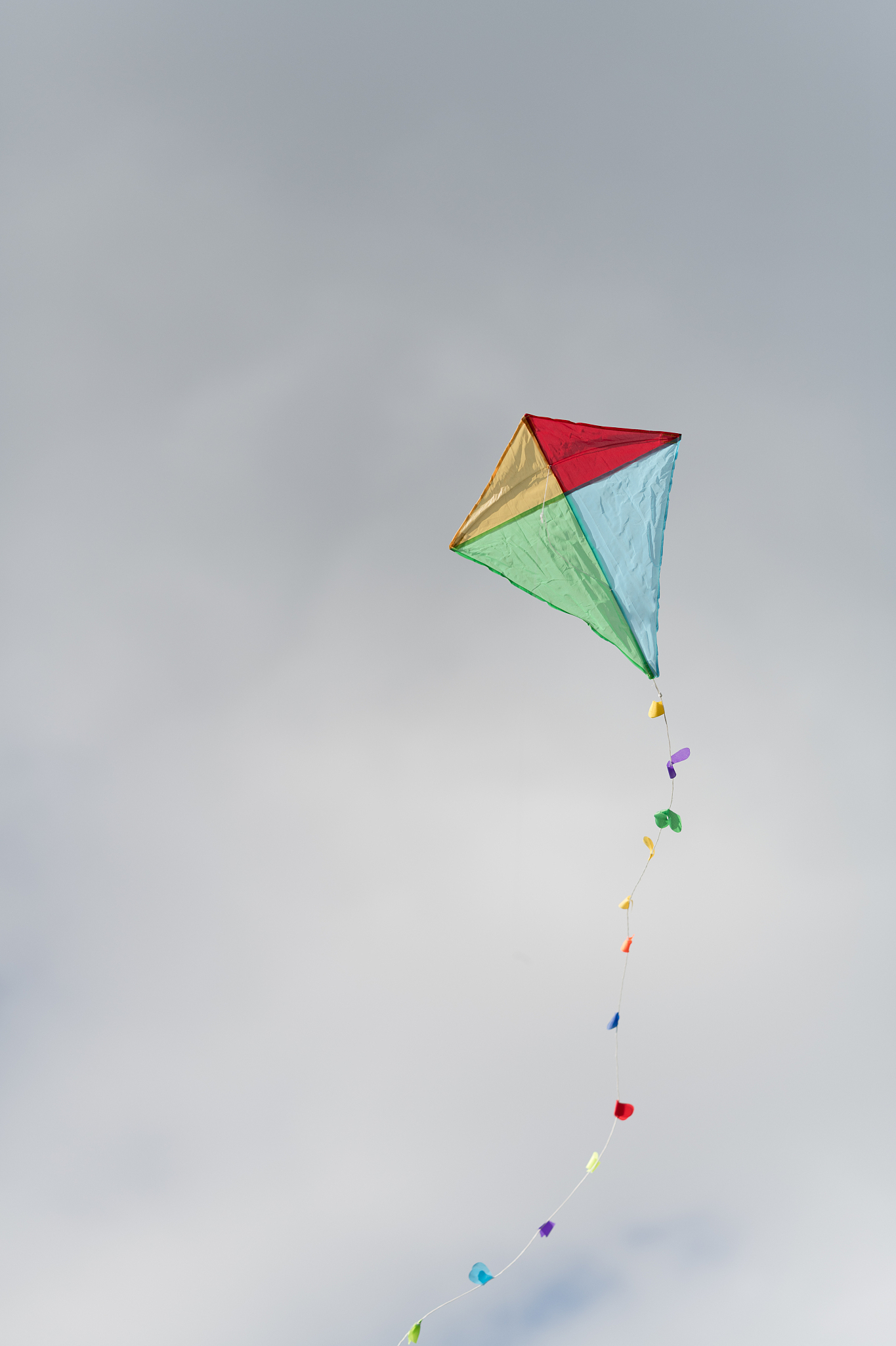 colorful kite in a cloudy sky
