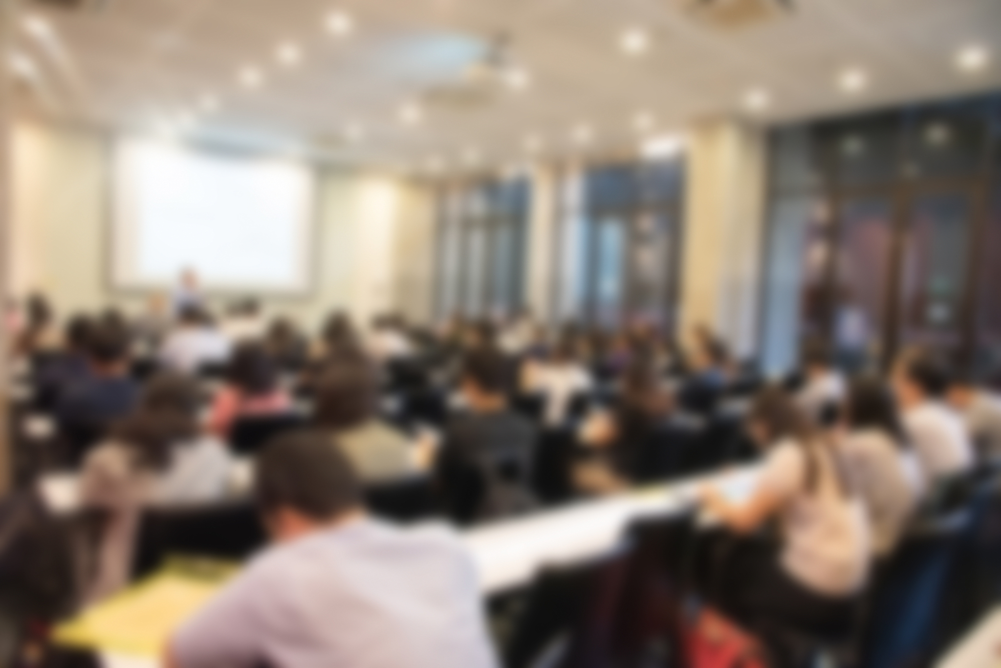 blurred background of business people in conference hall or semi