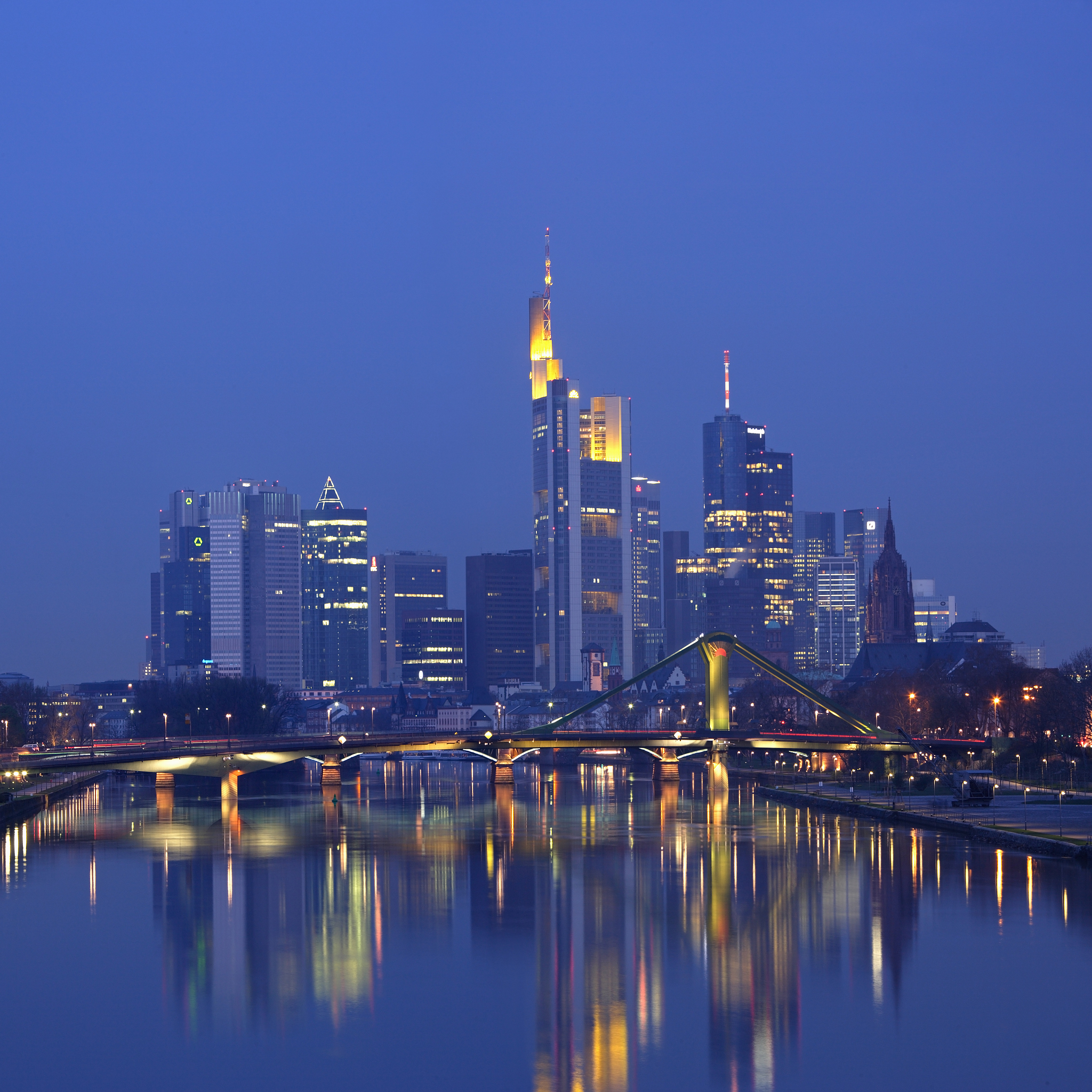 germany, frankfurt am main, city skyline reflected in river main