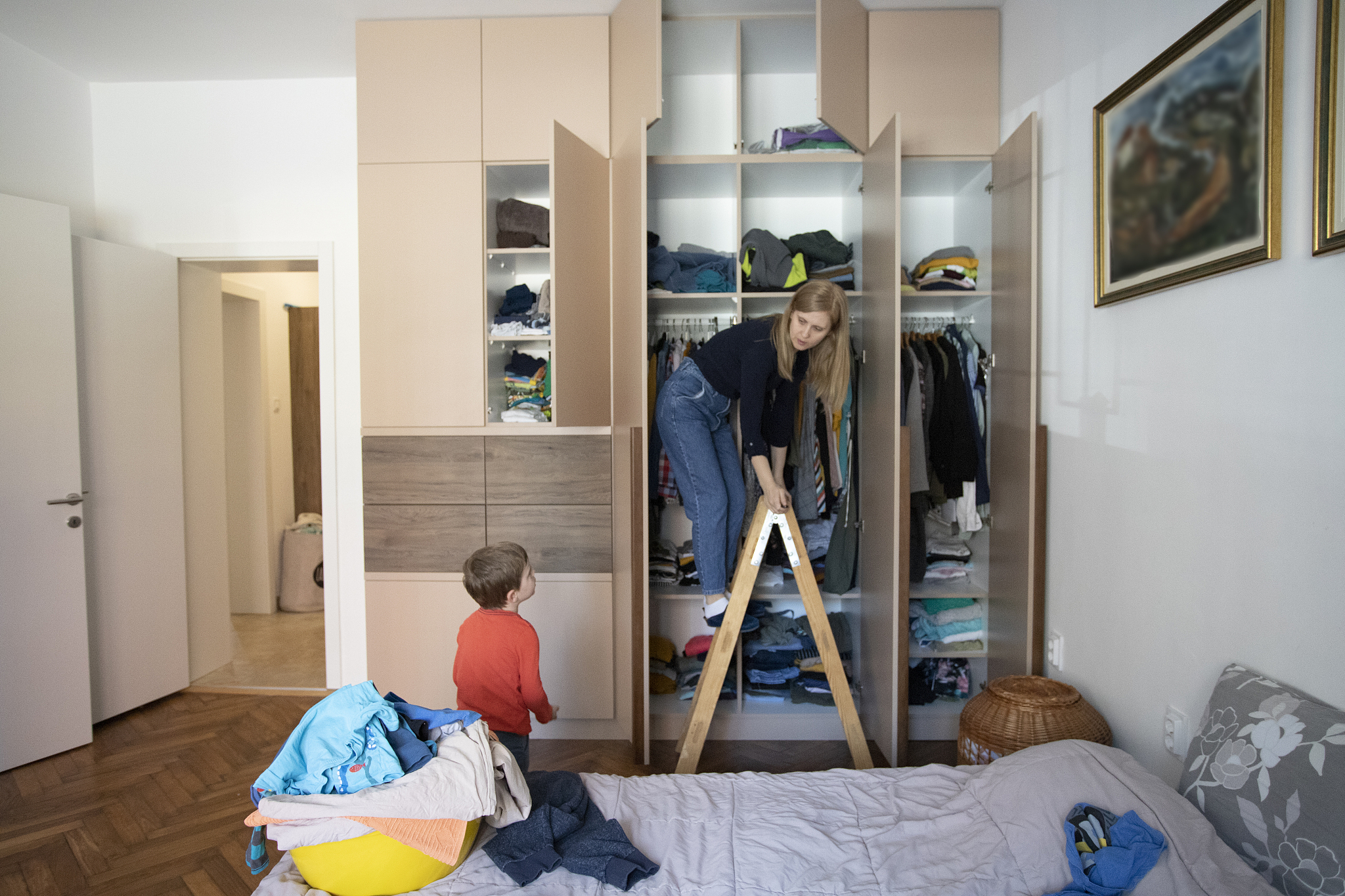 woman reorganizing her wardrobe