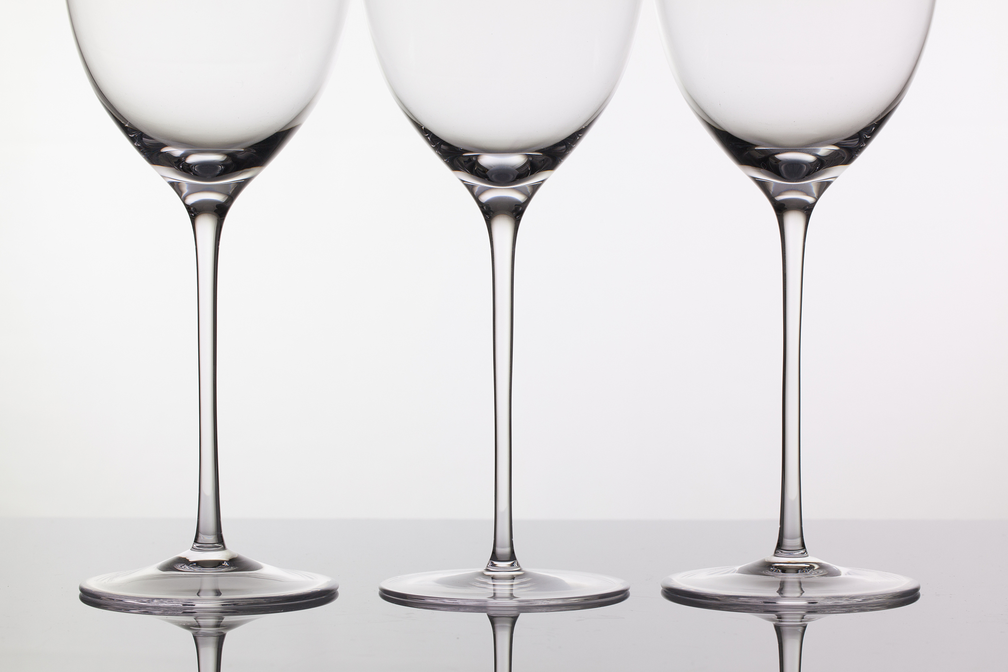 three empty glasses of wine