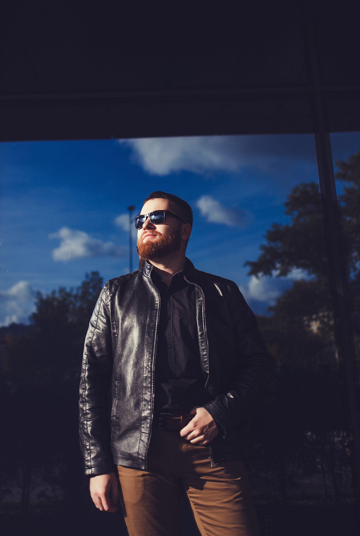 man dressed in black leather jacket