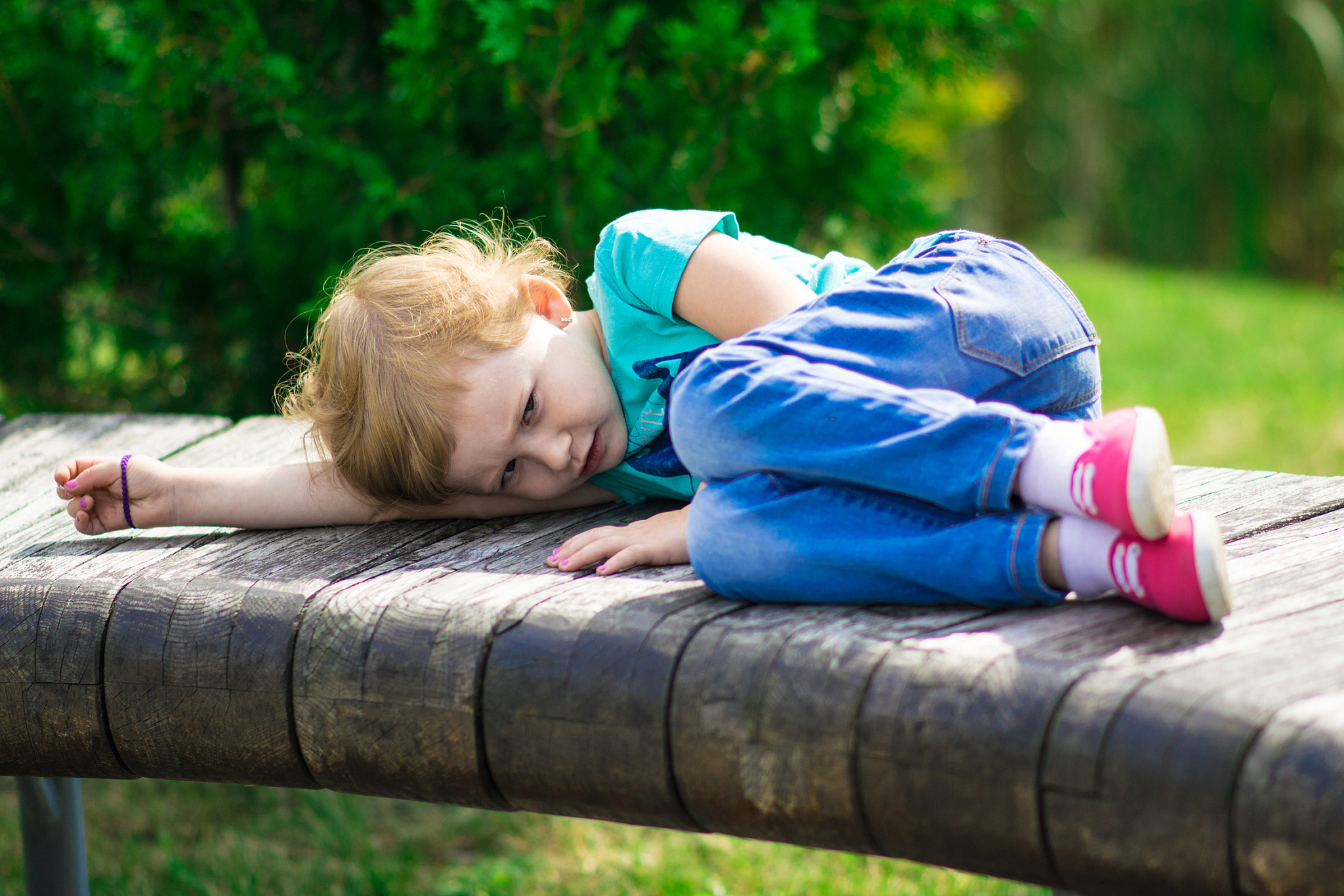 cute little girl in the park in summer day