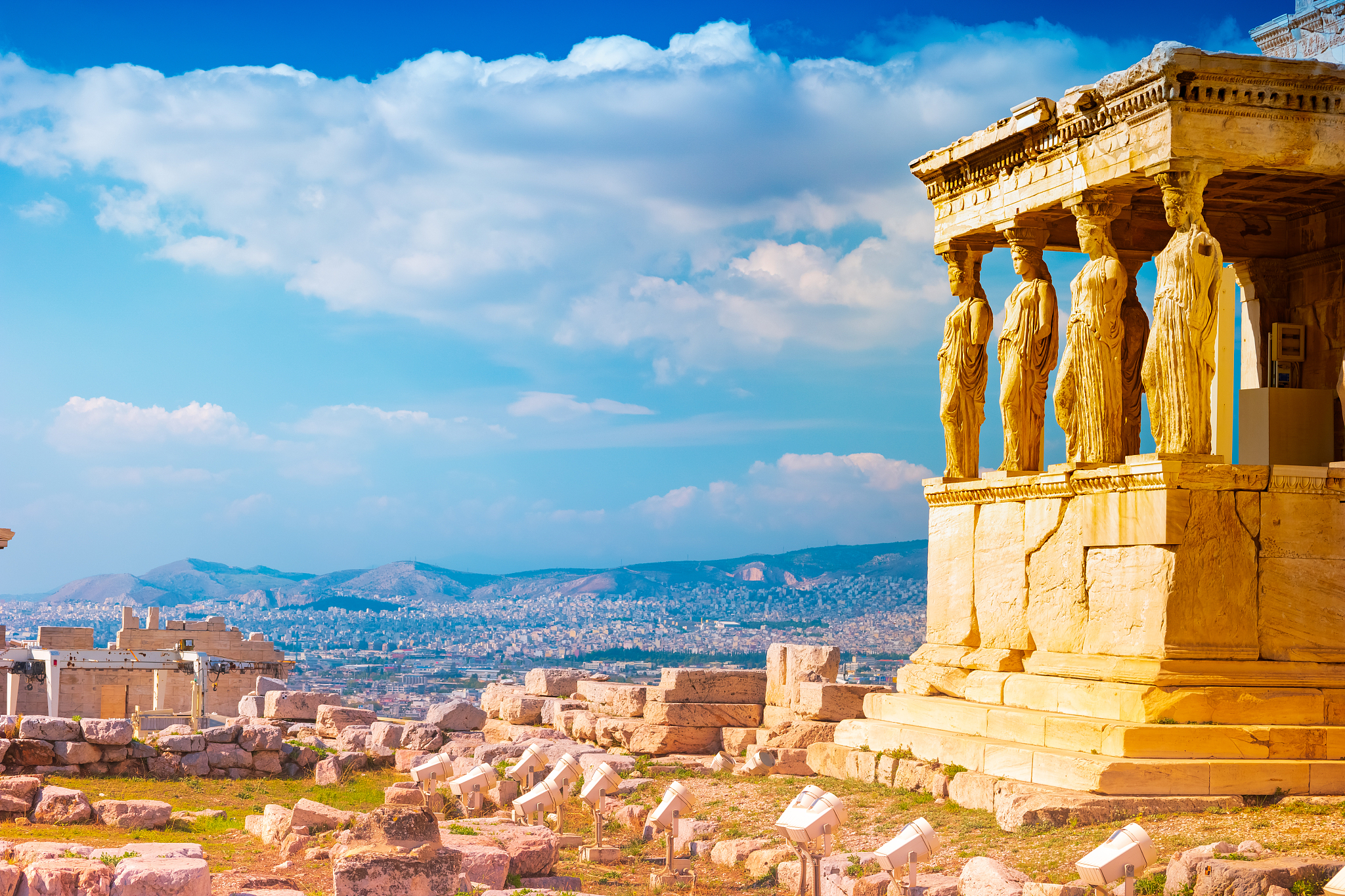 stone porch with caryatids in erechtheion temple in acropolis