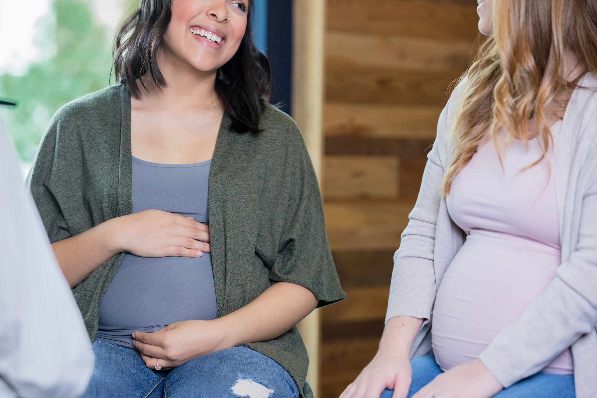diverse women supporting each other during pregnancy childbirth 