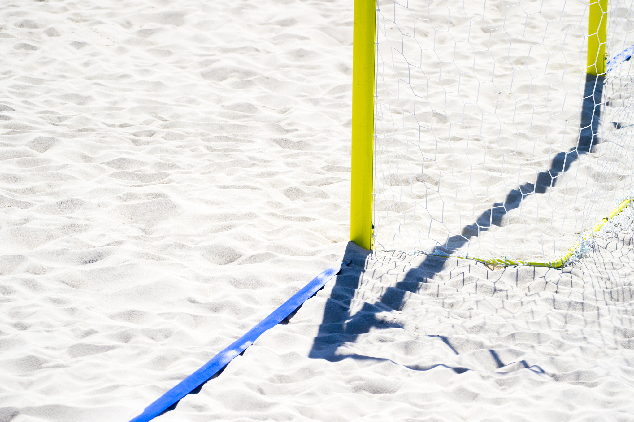football summer sport. closeup goal net on a sandy beach outdoor