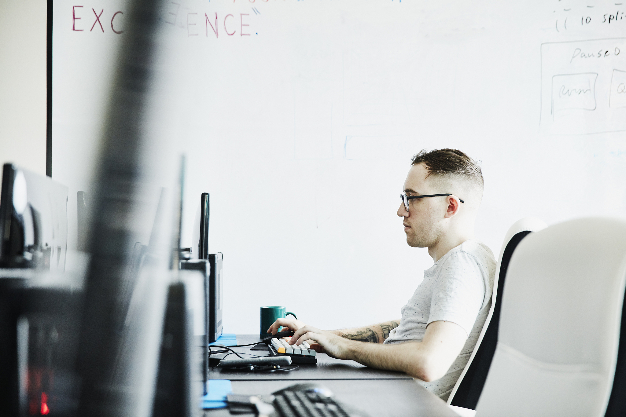 engineer coding virtual reality program while working in compute