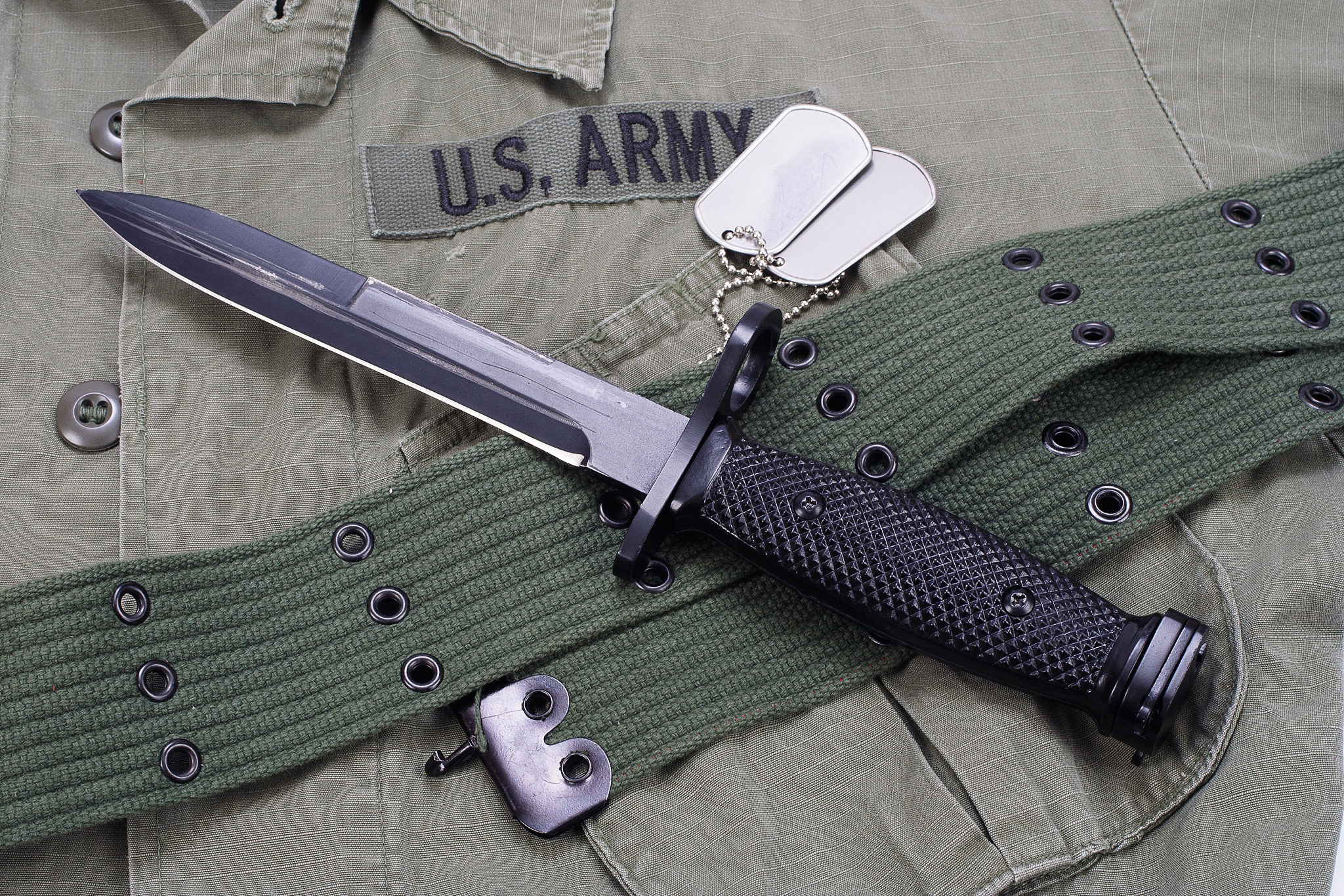 m16 rifle bayonet on uniform background