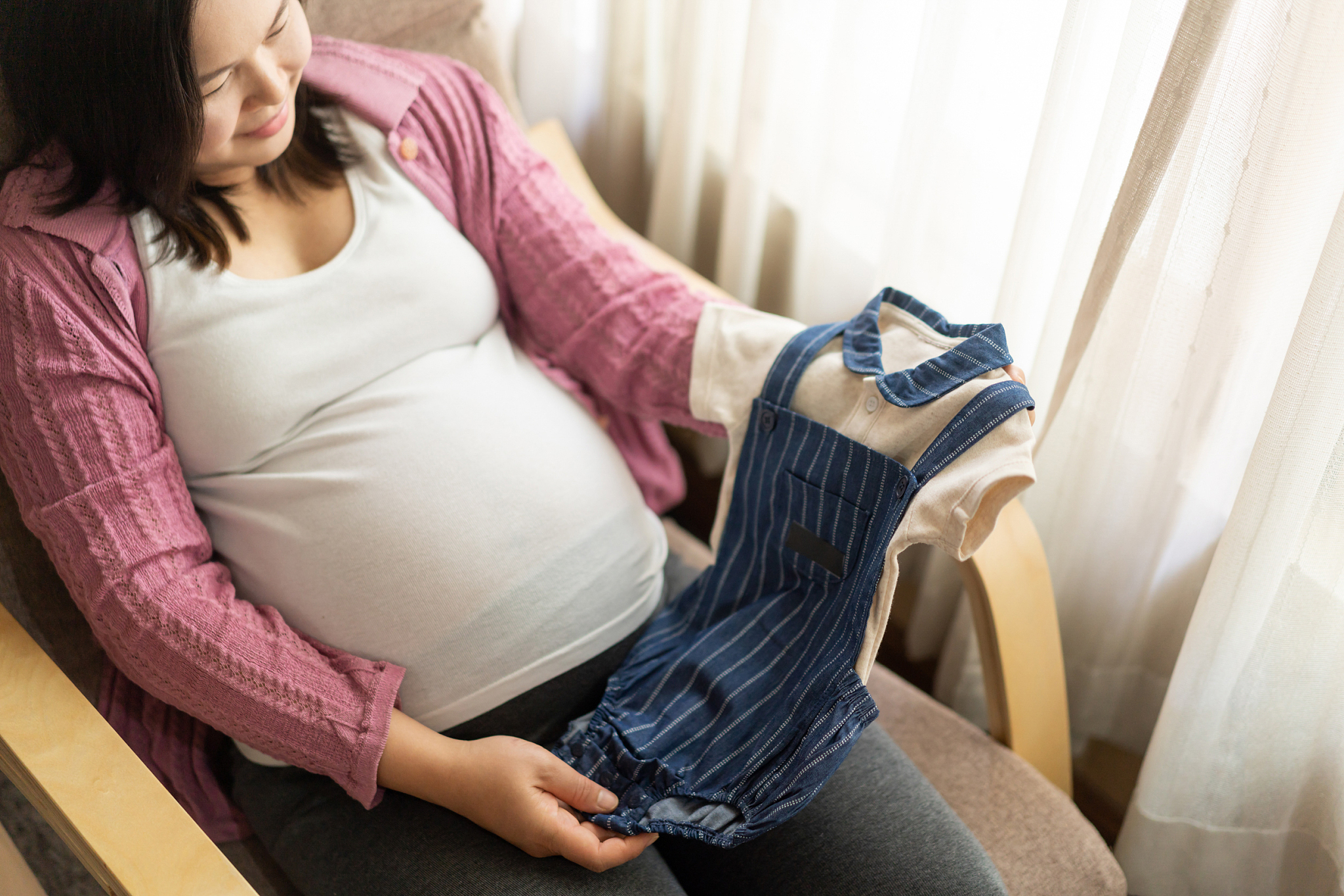 happy pregnant woman and expecting baby at home.