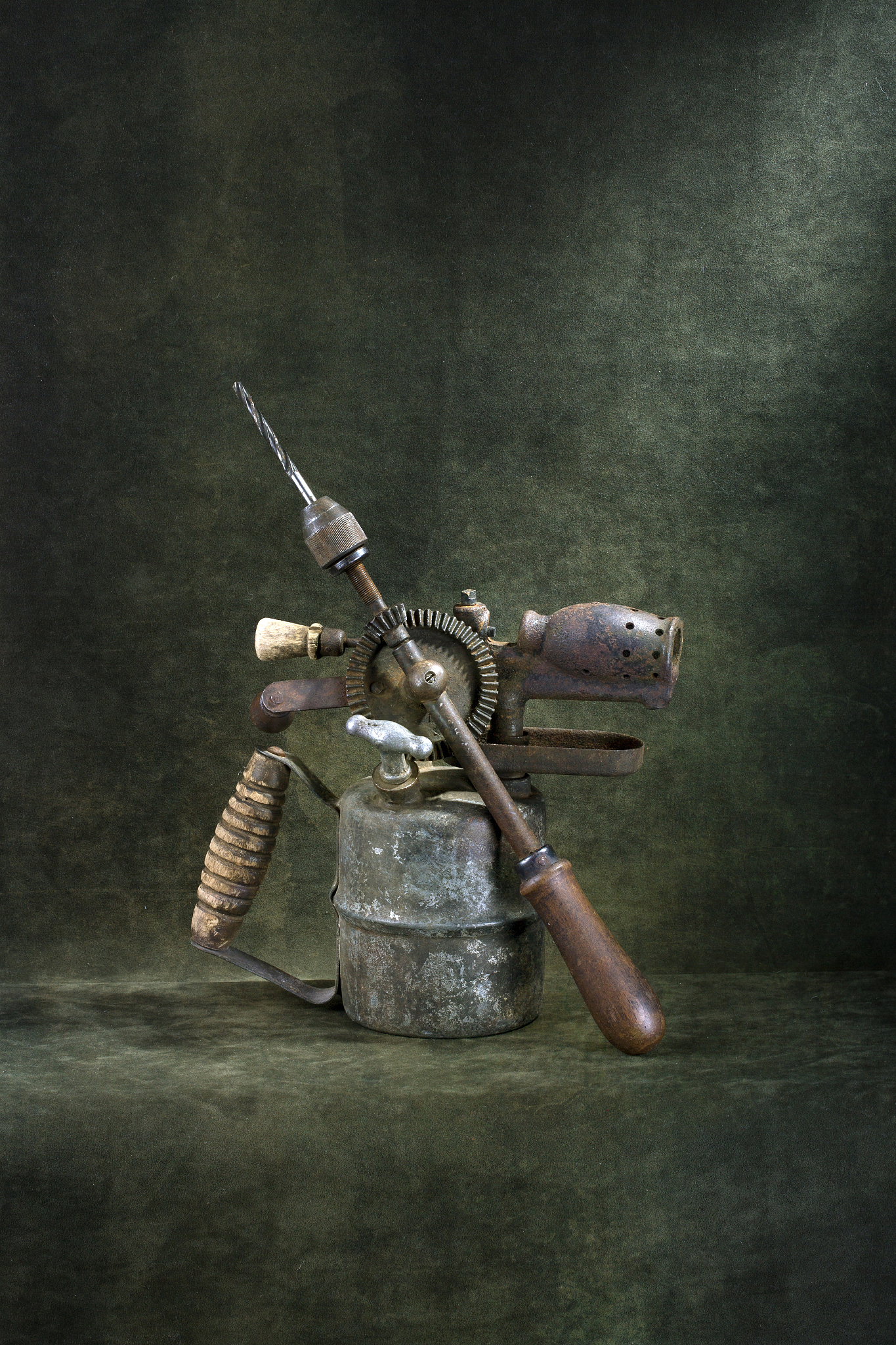 still life with an old hand drill and a blowtorch