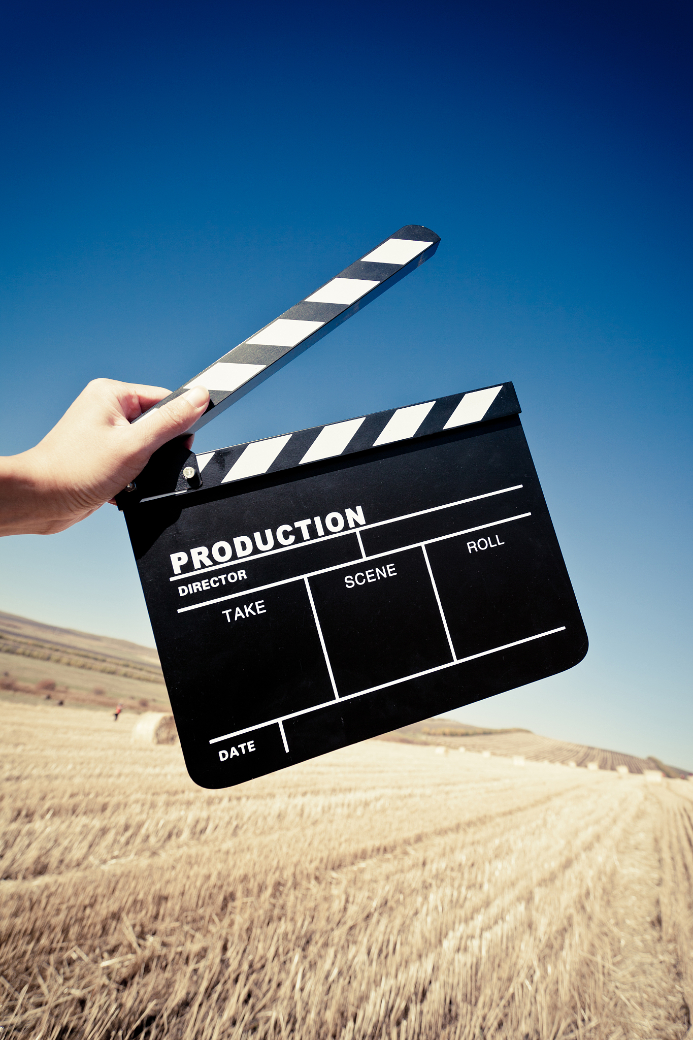 hands holding a movie clapboard