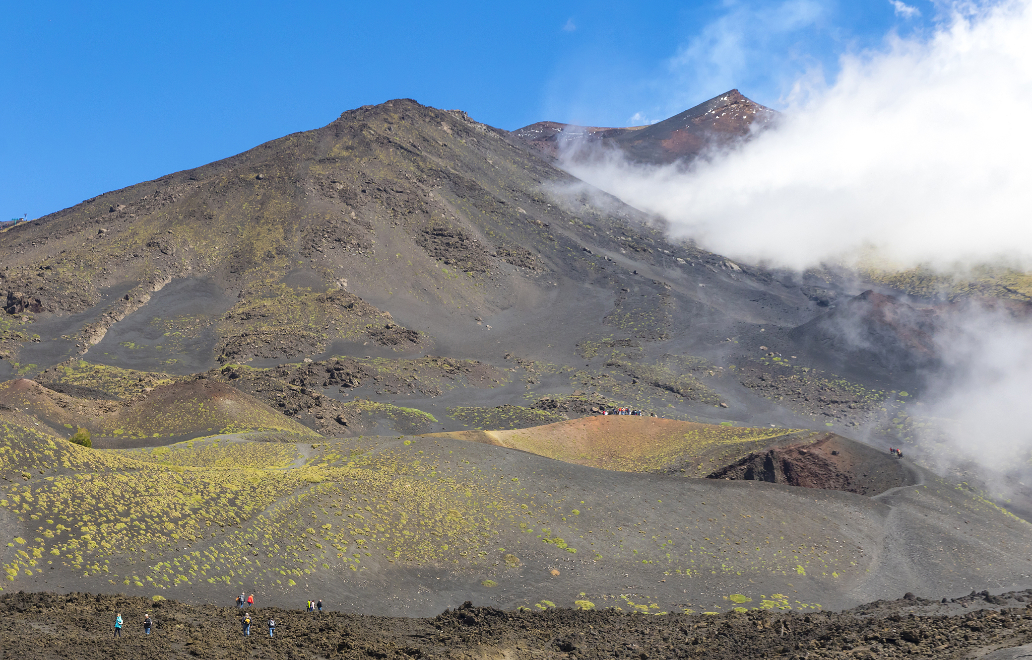 hiking on mount etna, etna national park, sicily, italy