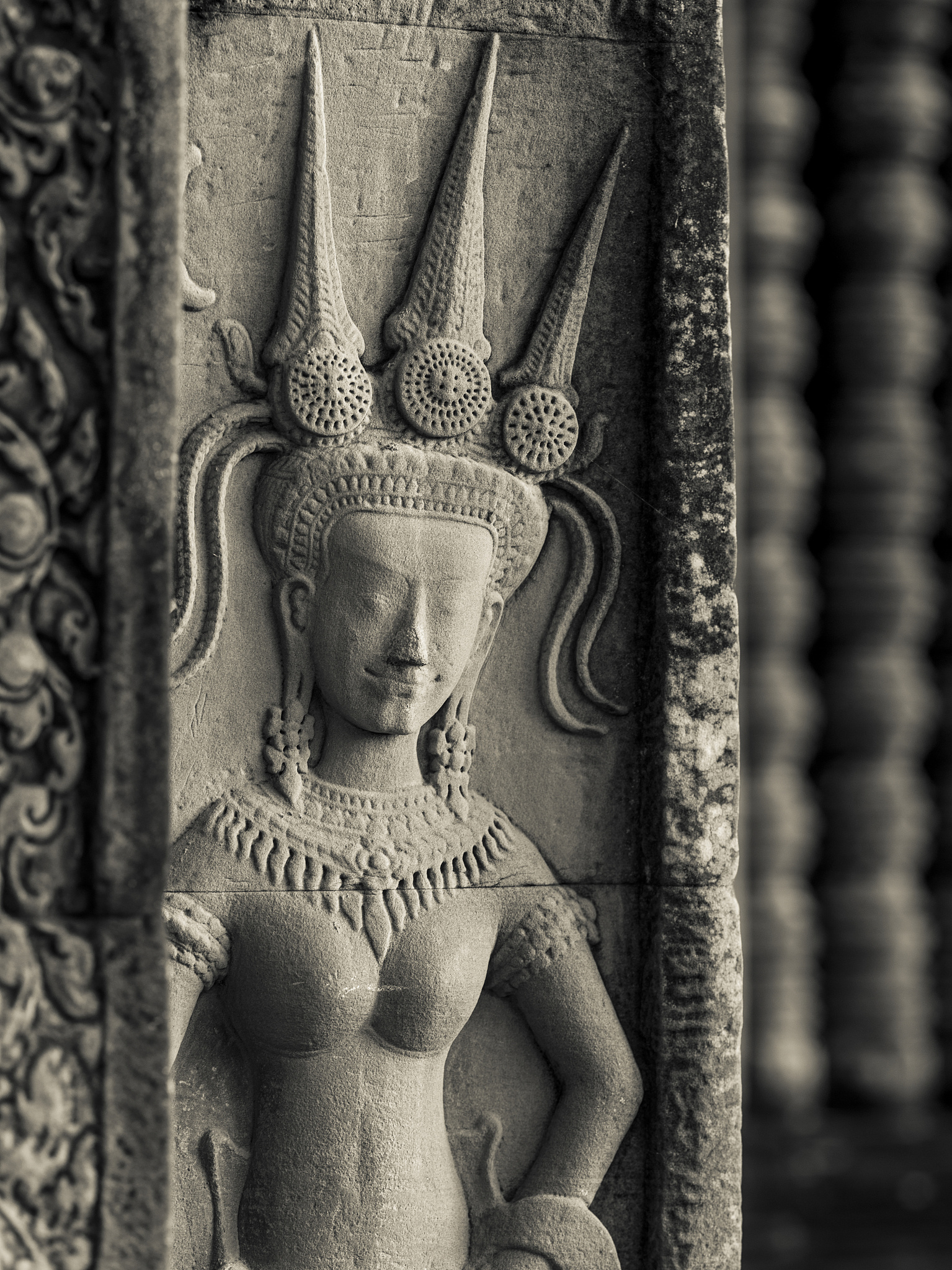 buddhist figure carved in stone at a buddhist temple
