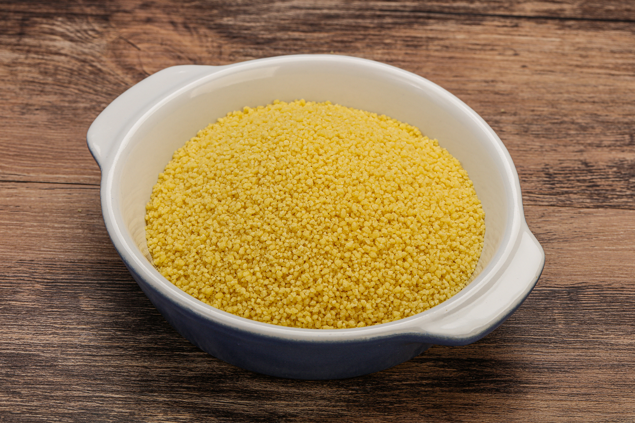 raw cous cous heap in the bowl