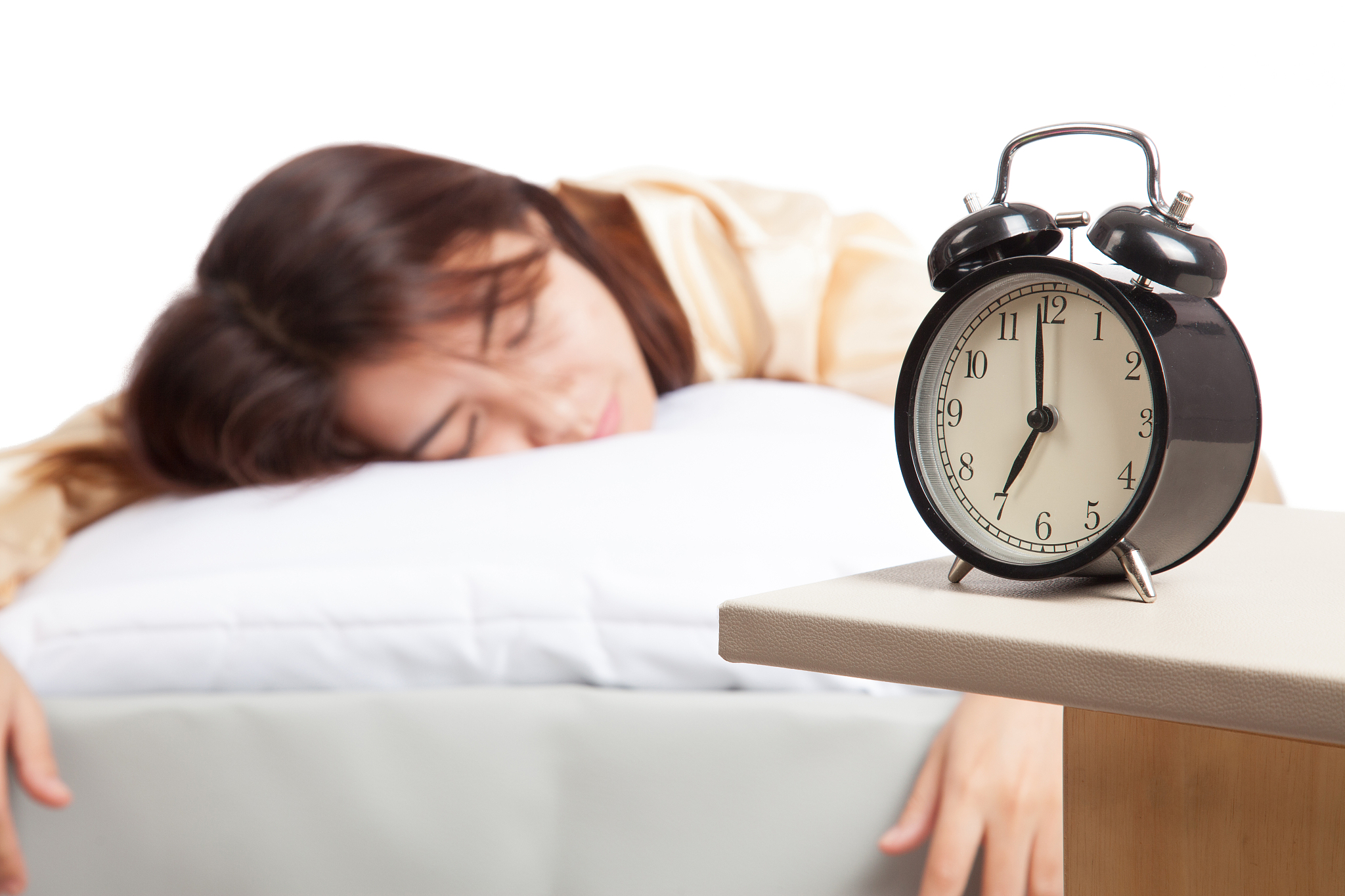 sleeping asian girl with alarm clock