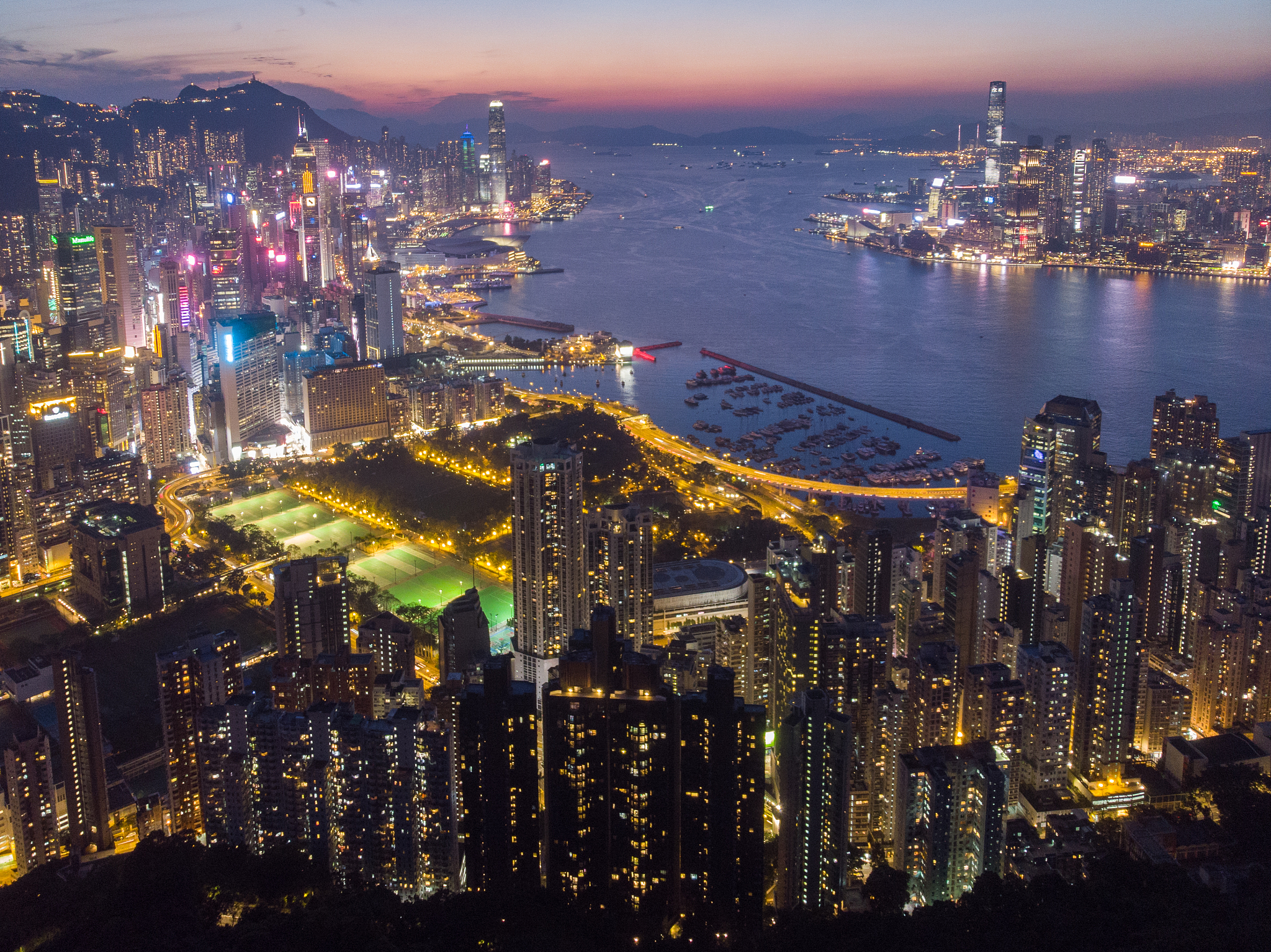 high angle view of illuminated city buildings at night