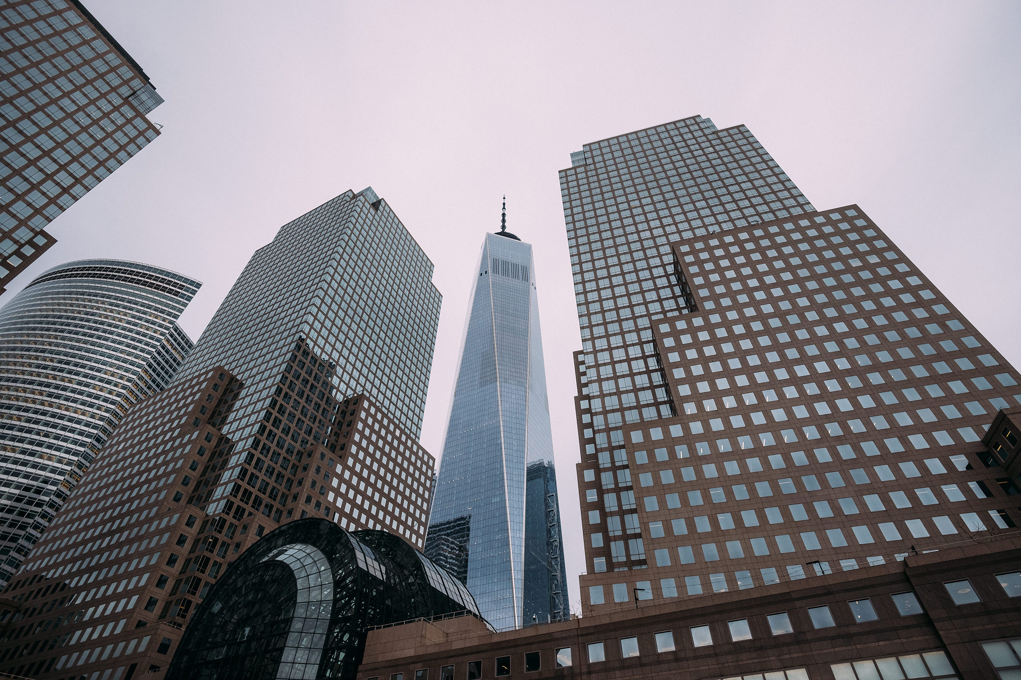 the facade of the modern glass buildings of the financial distri