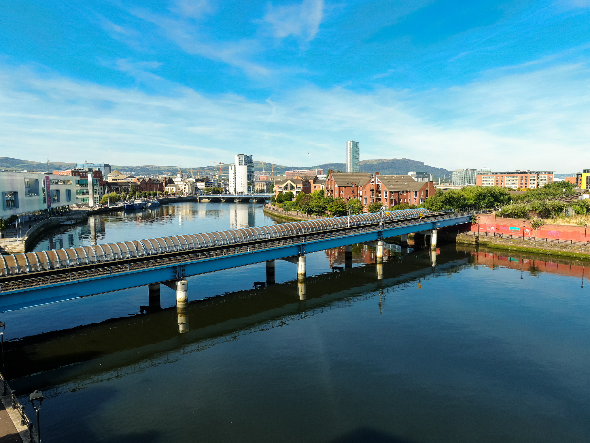 aerial view on river and buildings in city center of belfast nor