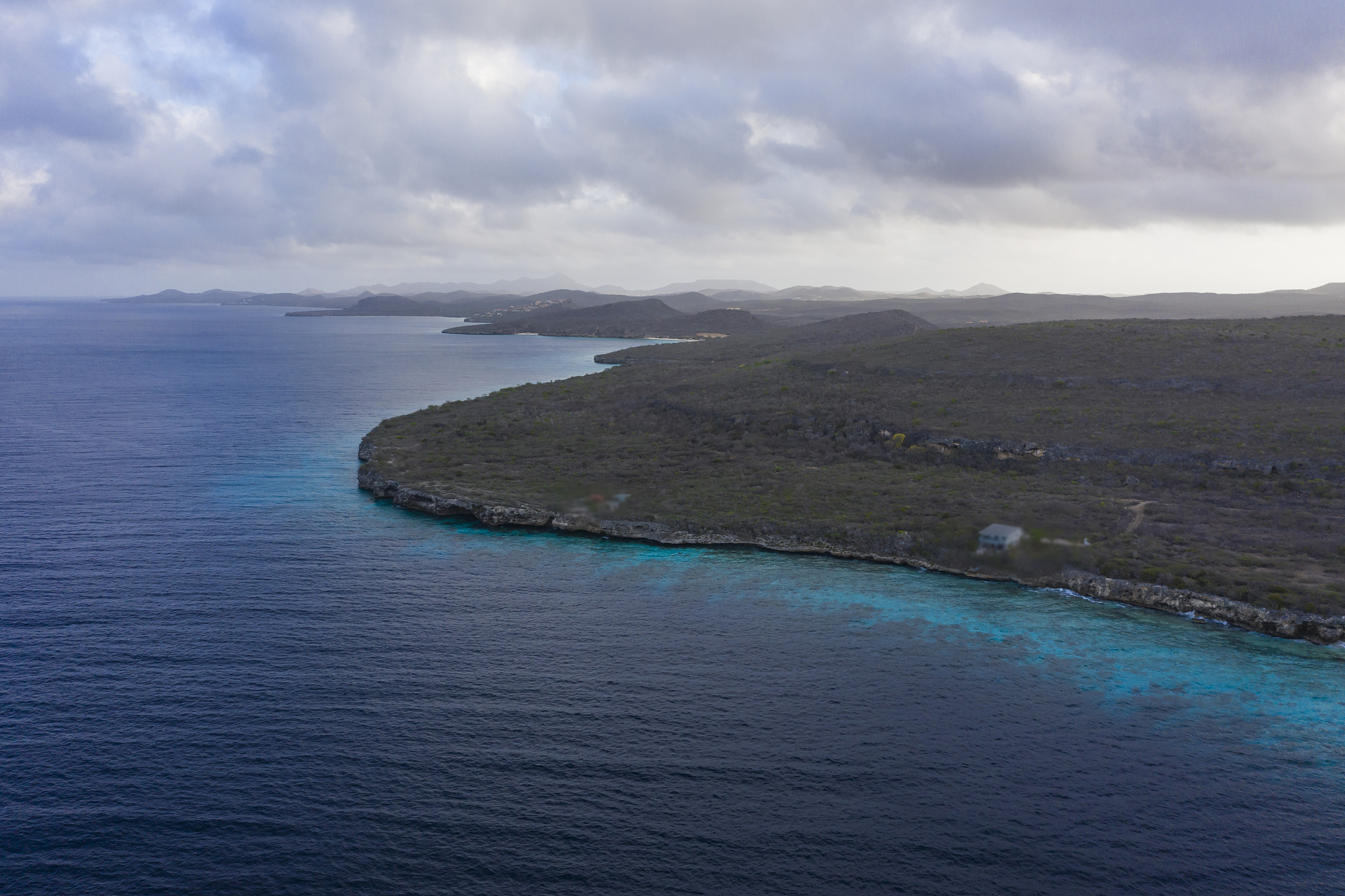 aerial view over area cas abao with coastline and turquoise wate