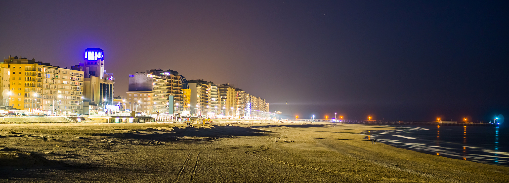 the boulevard and beach of blankenberge lighted at night, popula
