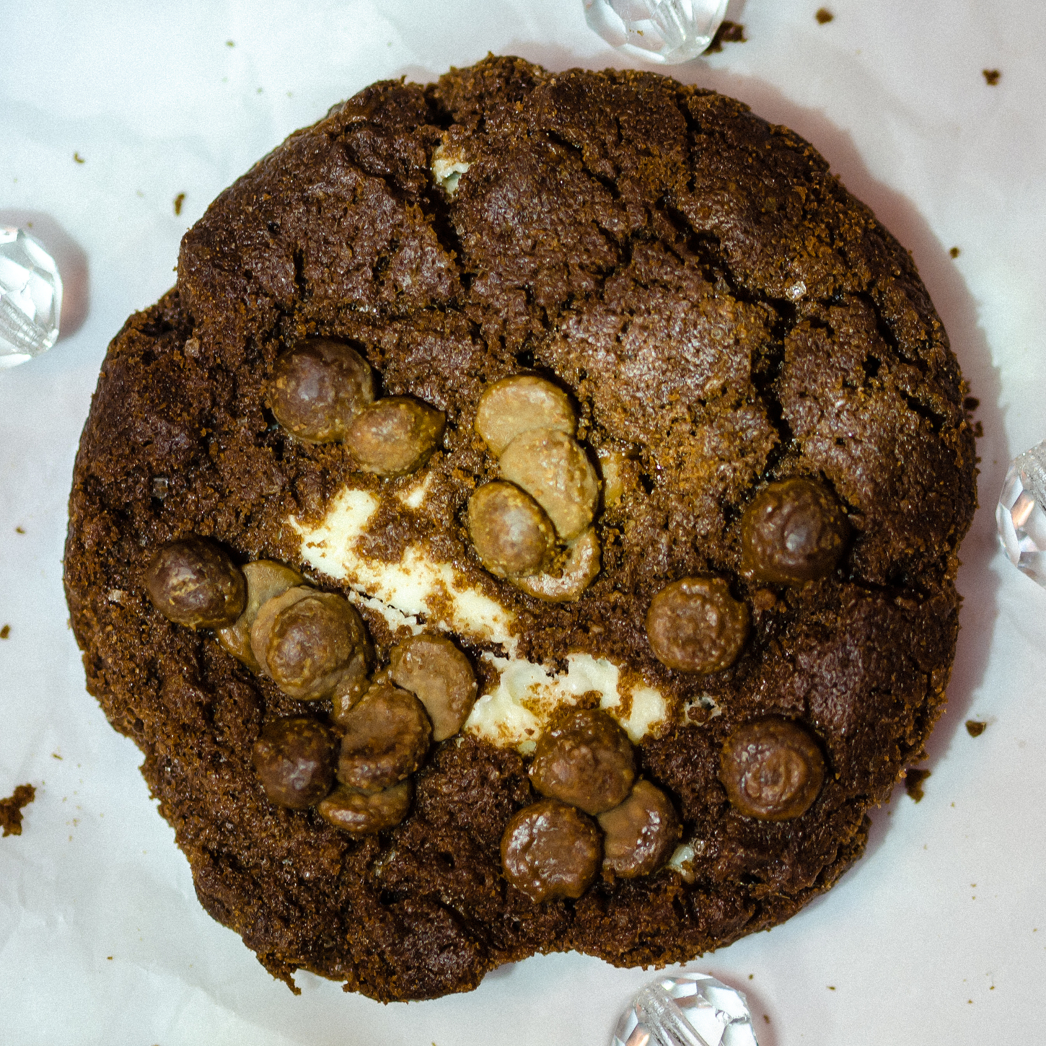 single chocolate chip chocolate cookie shot from above