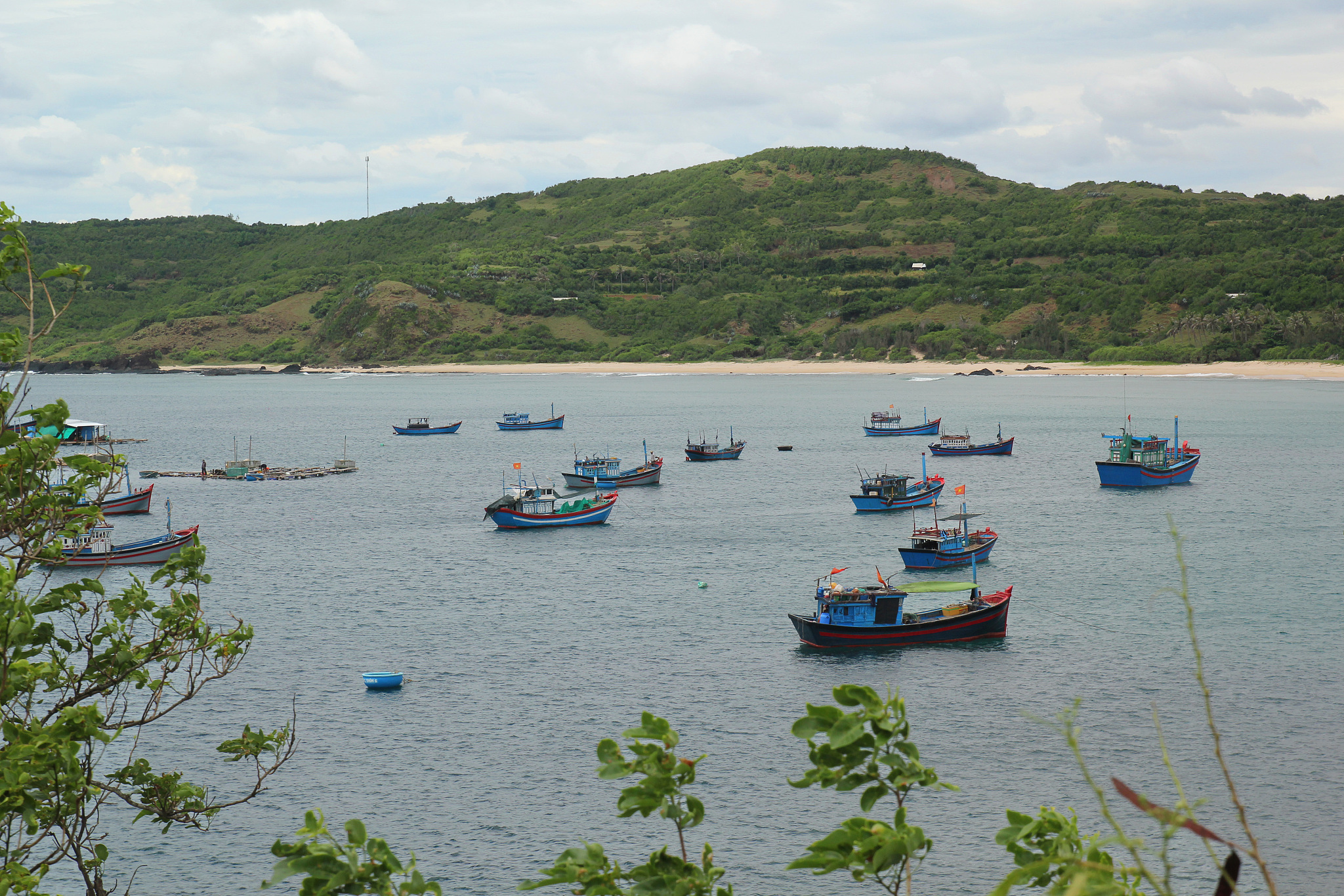 beach, mountain, boat and the sea.