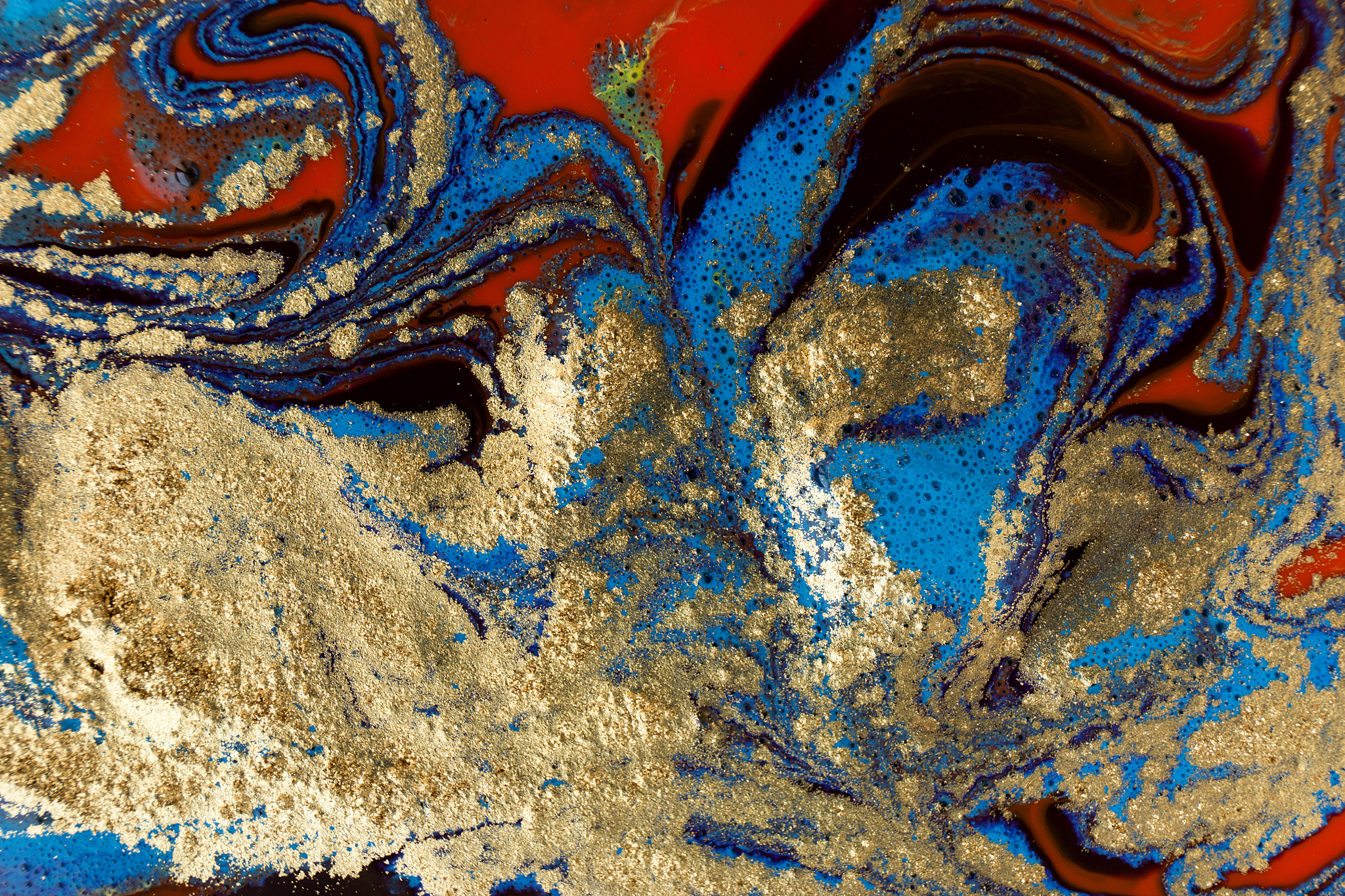 beautiful mixed inks paint with golden powder background.
